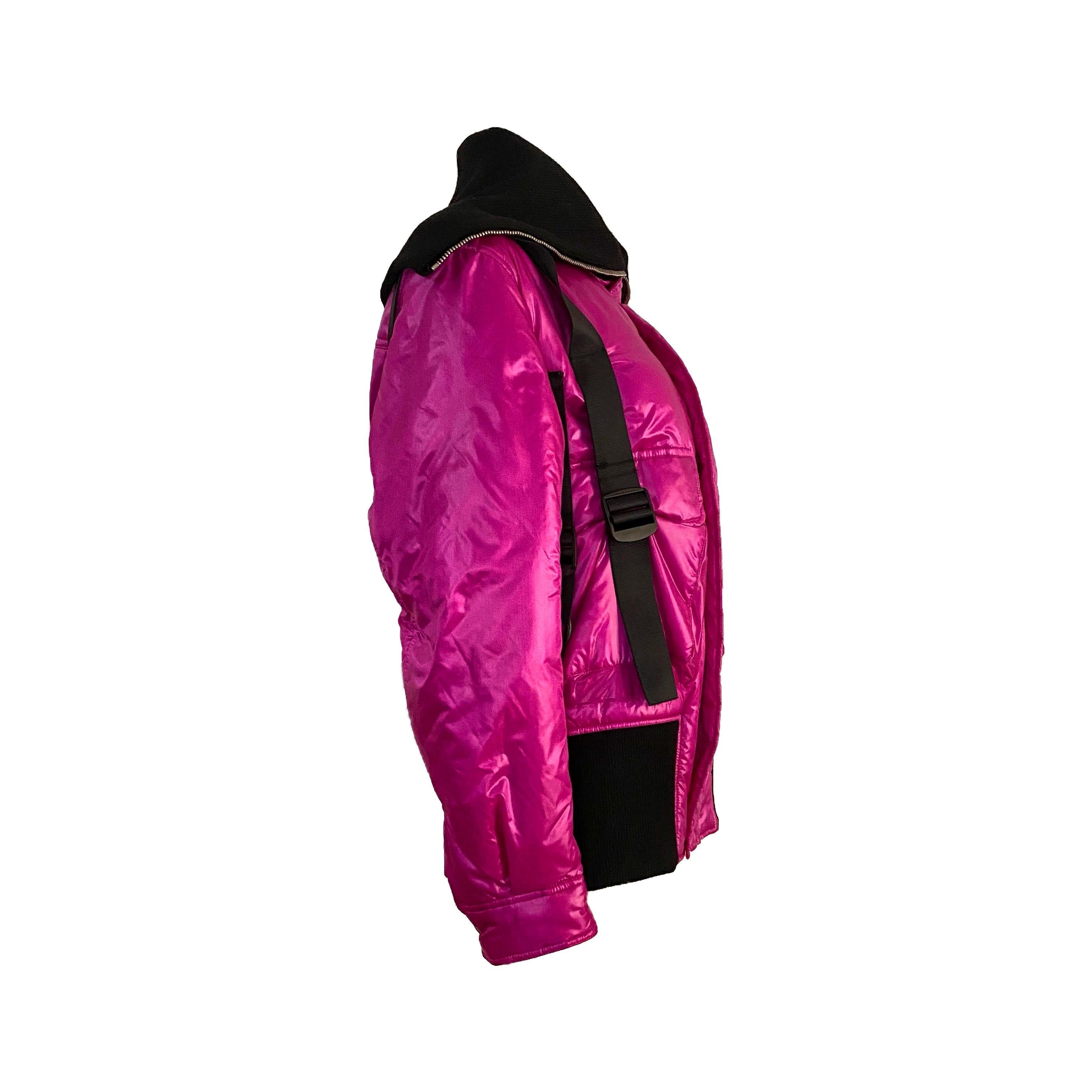 Dolce & Gabbana Fall/Winter 2003 Hot Pink cargo Parachute Bondage Bomber Jacket.
Multiple black nylon fastening straps and black thick wool high collar. Two maxi pockets on the front matched by a smaller one on the left sleeve. Rare colorway.

Size