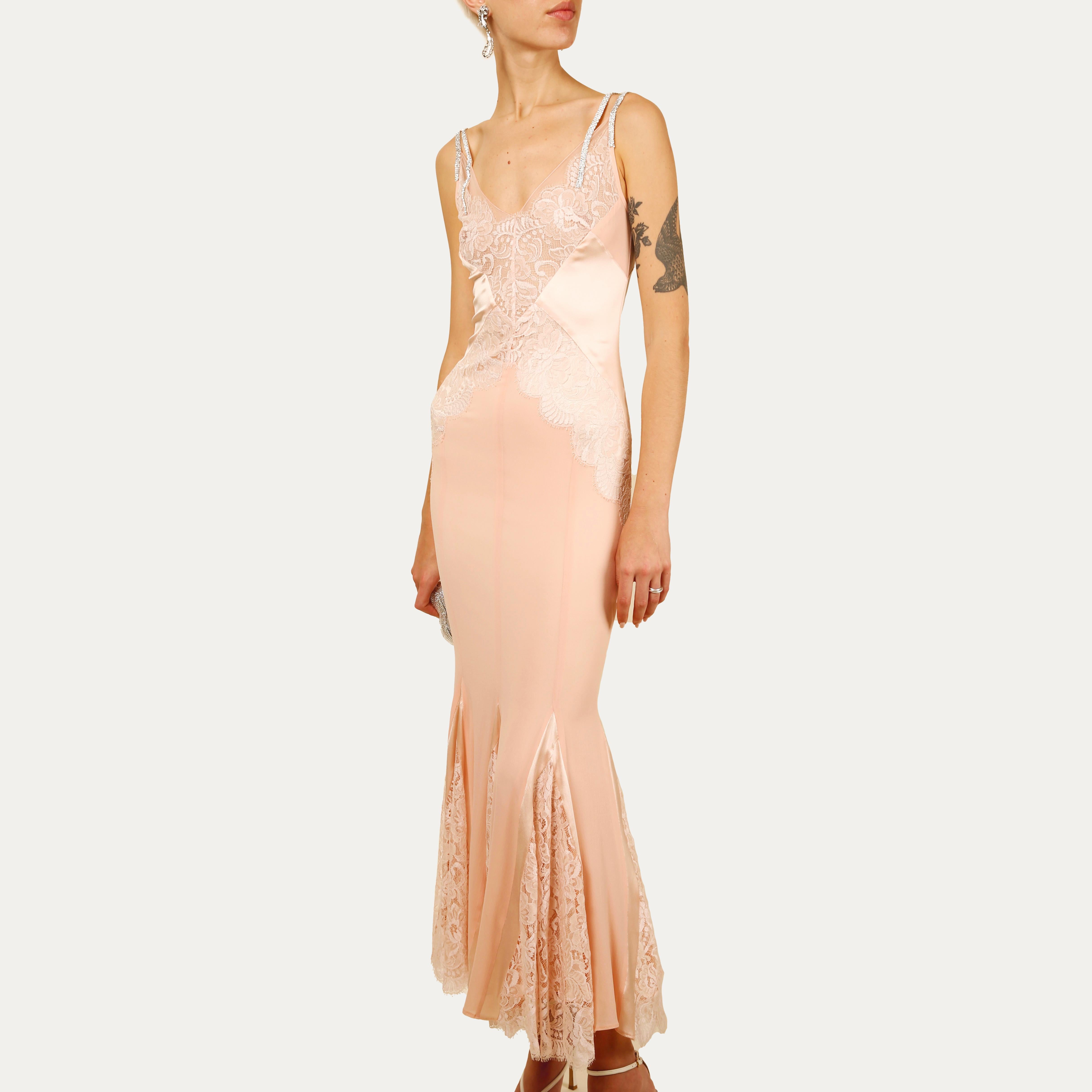 An Incredibly rare floor length gown from Dolce & Gabbana's Fall 2004 collection
Pink silk and lace cut out sheer dress with double crystal straps
Concealed back zip

Size:
IT 42. This dress has plenty of stretch so will fit various sizes, please