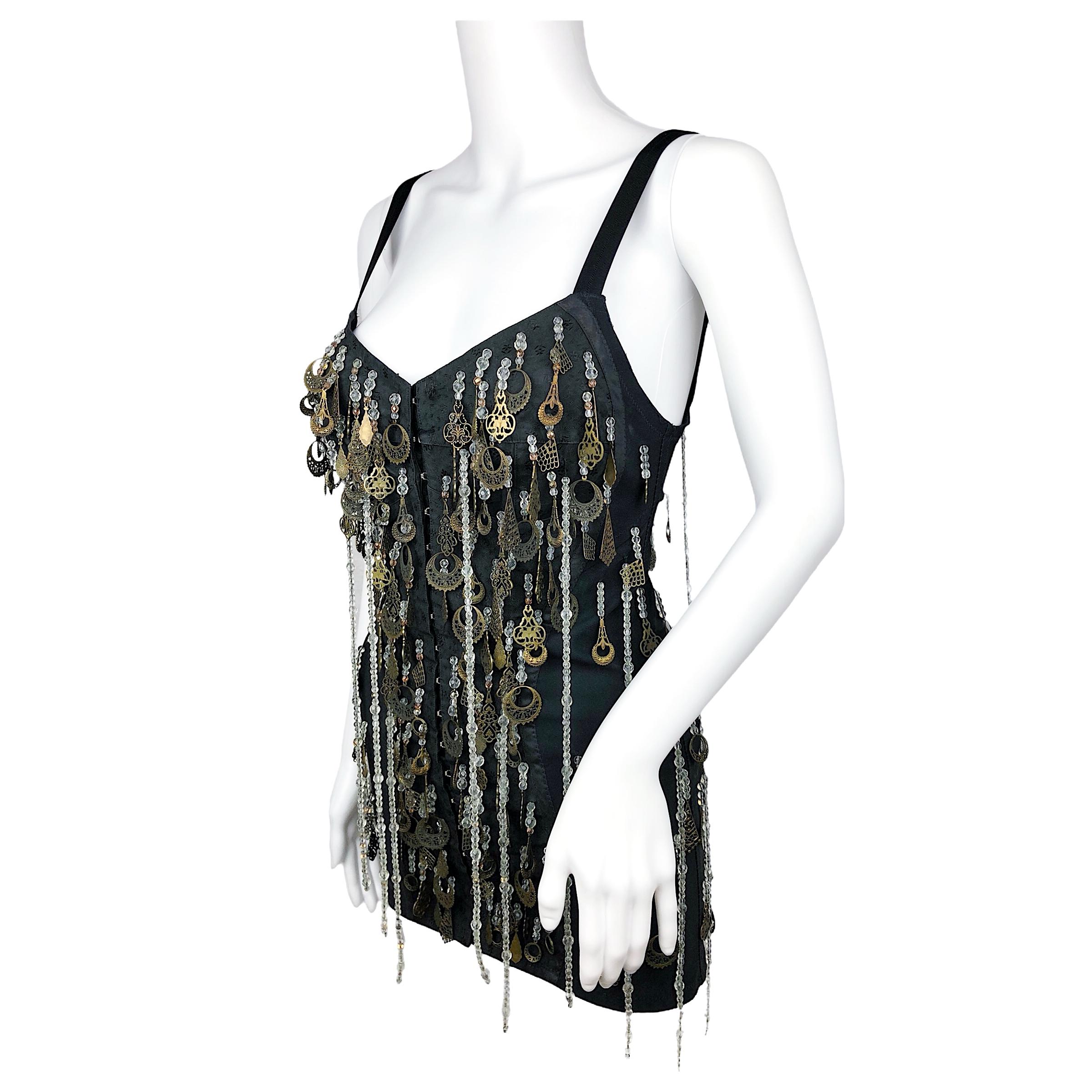 Incredible Dolce & Gabbana long corset with pearls fringes and embellishment from Fall Winter 1990 collection. Size is Italian 44, fits like a US 6, UK 10, EU 38. 
Condition: Excellent / Flaws: Missing a few embellishments as shown in pictures 