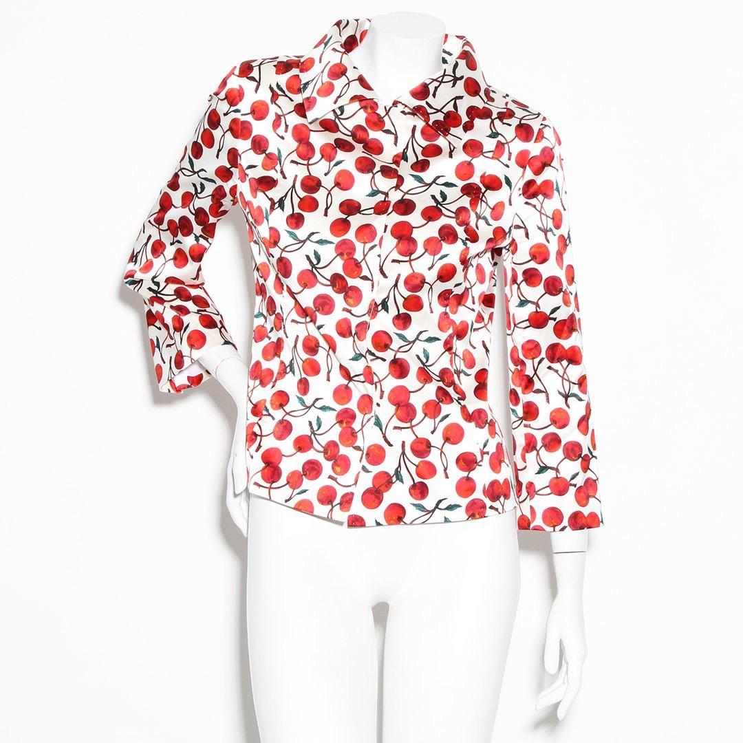 Cherry print jacket by Dolce & Gabbana 
Fall 1996
Satin blazer
Pointed collar
Cropped sleeves
Hidden placket snap closures
Silver metal hardware
Made in Italy 
Condition: Excellent vintage condition, Some markings on front. (see photos)