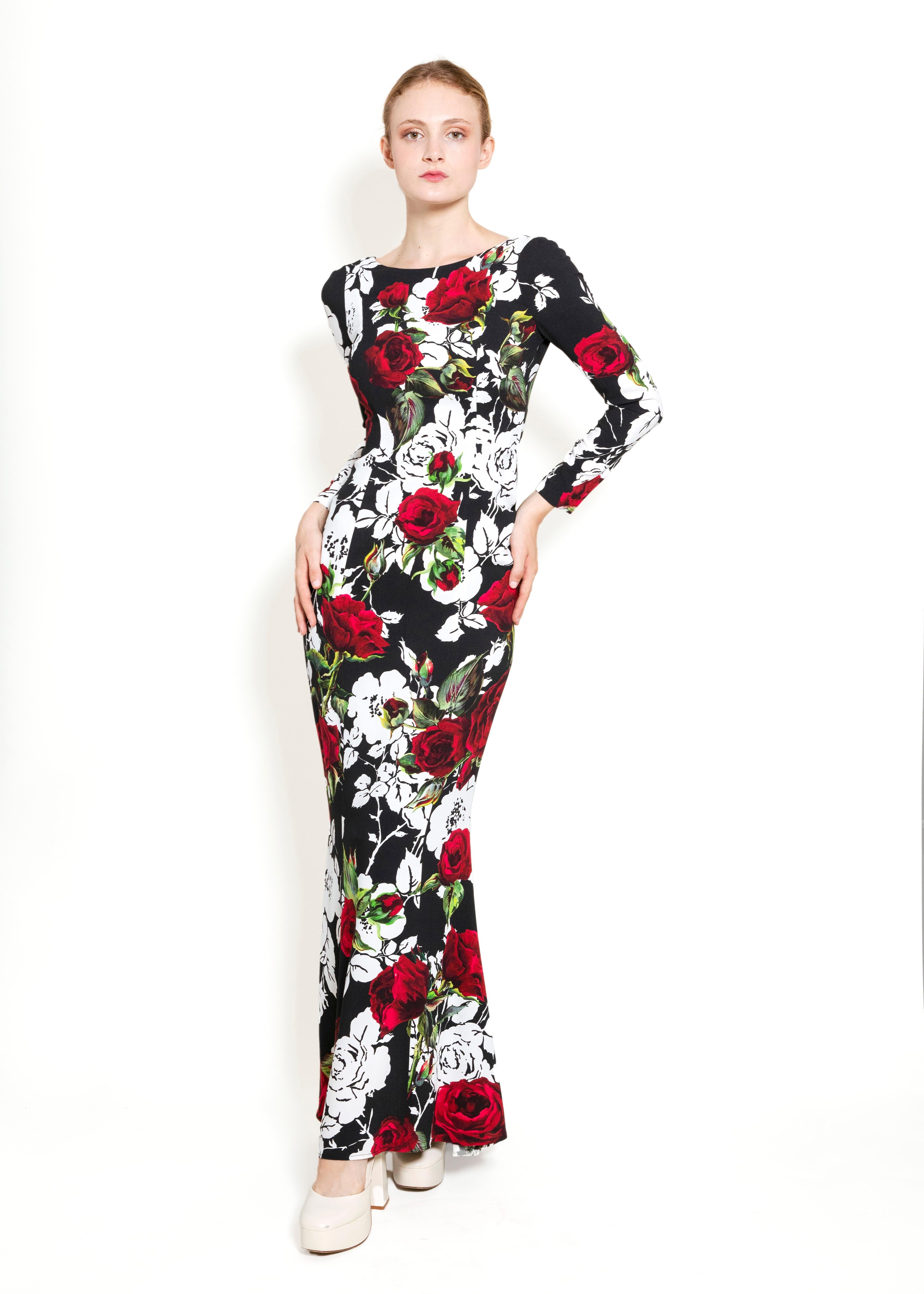 Experience a world of luxury with the Dolce & Gabbana Fall 2015 L/S Floral Dress. Crafted from exquisite fabrics to showcase a stunning mermaid silhouette, this unique floral dress is sure to dazzle and delight. Elevate your wardrobe with this