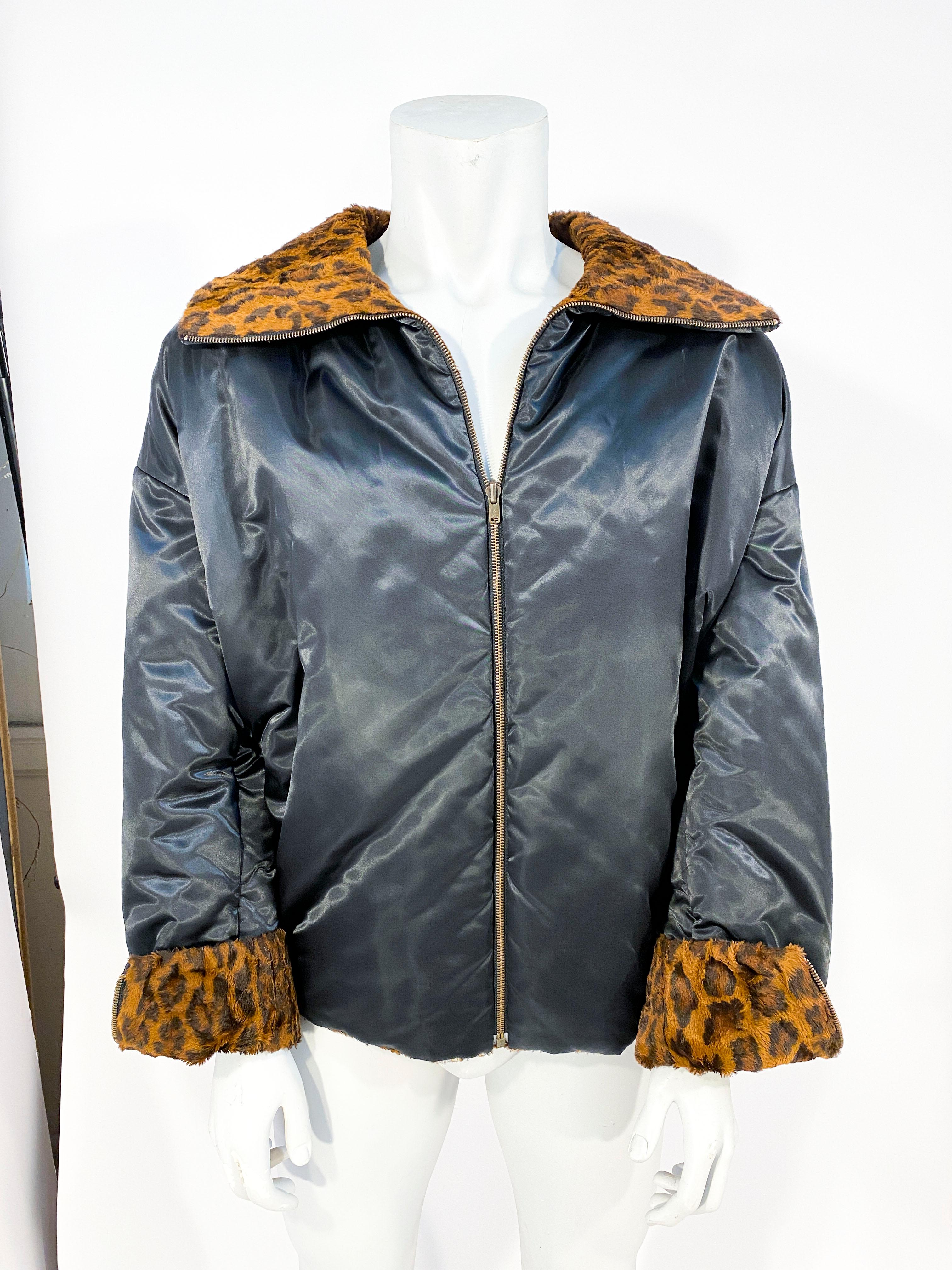 Dolce & Gabbana faux cheetah fur printed reversible jacket with a alternative black nylon face with letterman wording. The cuffs are zipped to accent the chosen side and the color is wide.