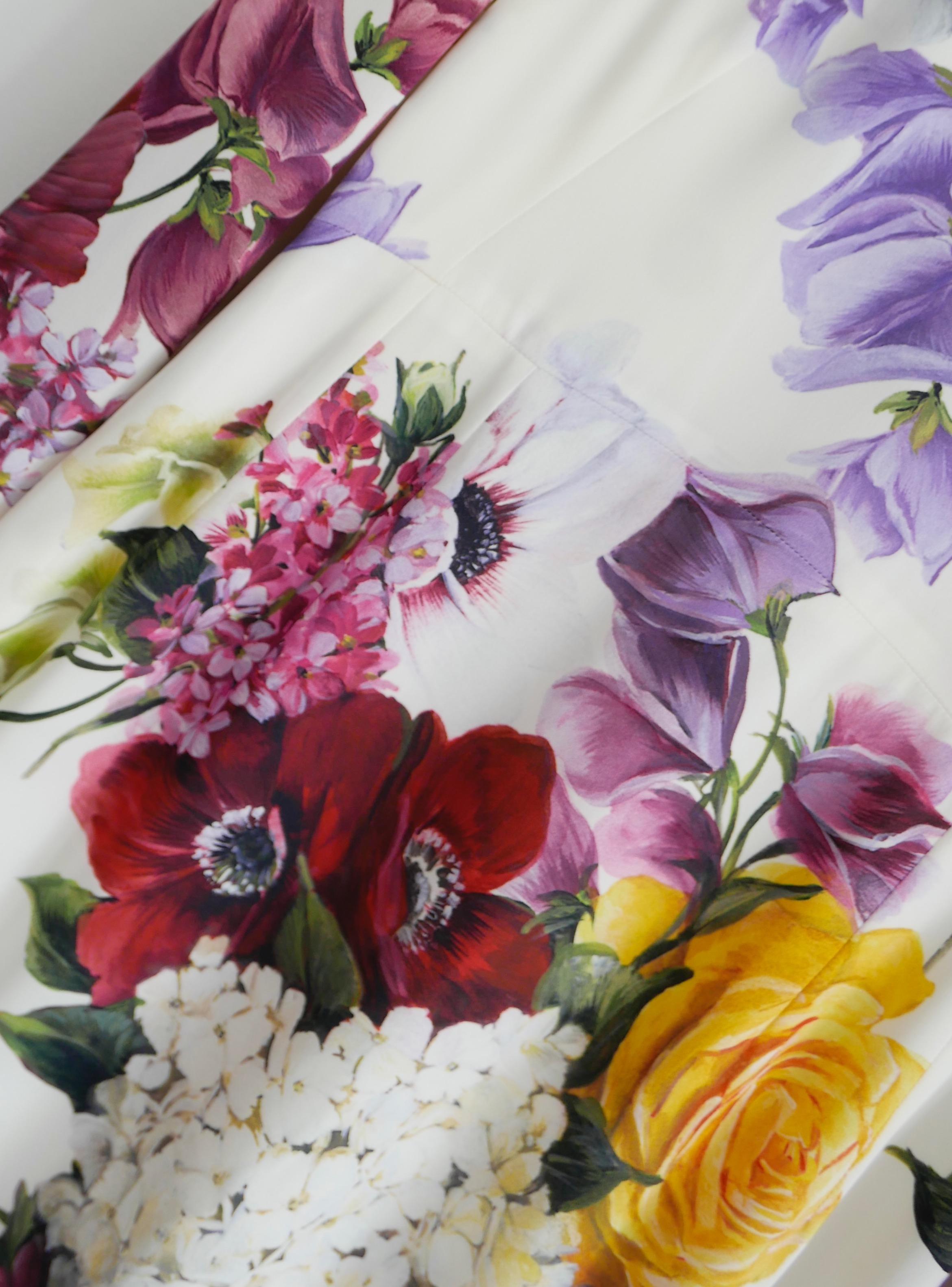 Gorgeous, ultra feminine Dolce & Gabbana floral bouquet print sheath dress. Bought for £1950 and new with tags. Made from smooth cream silk and elastane crepe with a vivid floral bouquet print featuring hydrangeas, anemones, roses and sweet peas. It