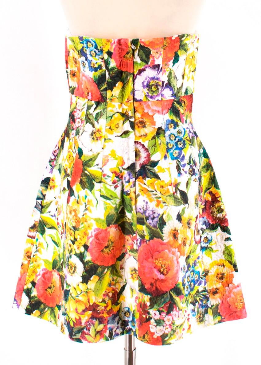 Dolce & Gabbana's colourful floral-brocade dress.The cut creates a feminine silhouette and it's designed with an internal corset for support at the bust.Designed to be fitted at the bust and waist, slightly loose at the hip. True to size.
Internal