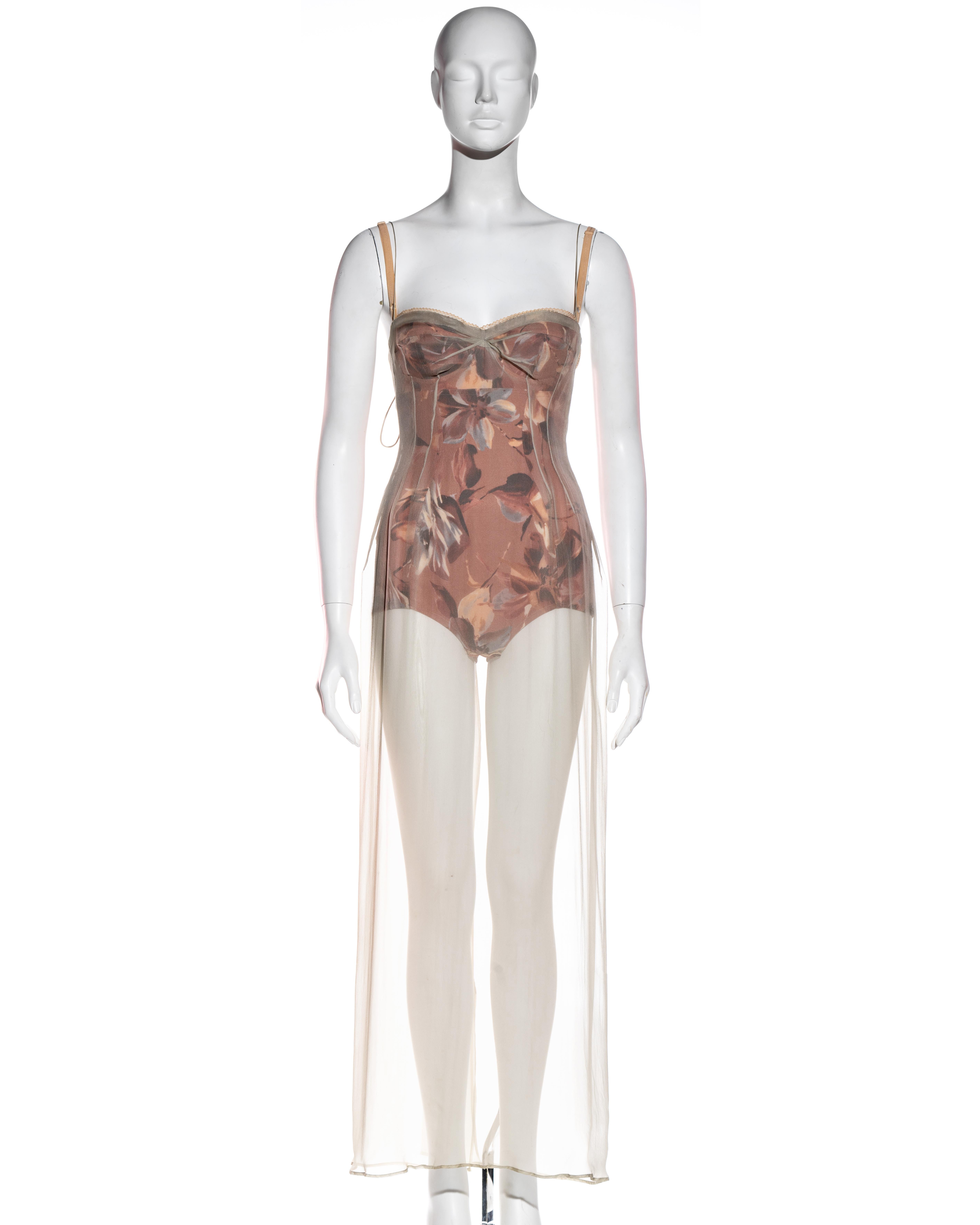 ▪ Dolce & Gabbana silk evening dress 
▪ Pale silk chiffon maxi dress 
▪ Beneath, a pink floral printed corseted bodysuit with metal hook closures 
▪ Delicate seaming and tucking on the bodice 
▪ Snap buttons and string bow fastening at back 
▪