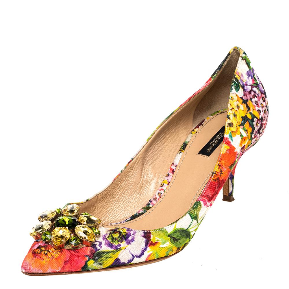 Add these stunning Dolce & Gabbana pumps to your collection and be glamorously ready for those daytime parties and events. Constructed in multicolored floral printed brocade fabric, these pointed-toe pumps feature crystal-embellishments on the front