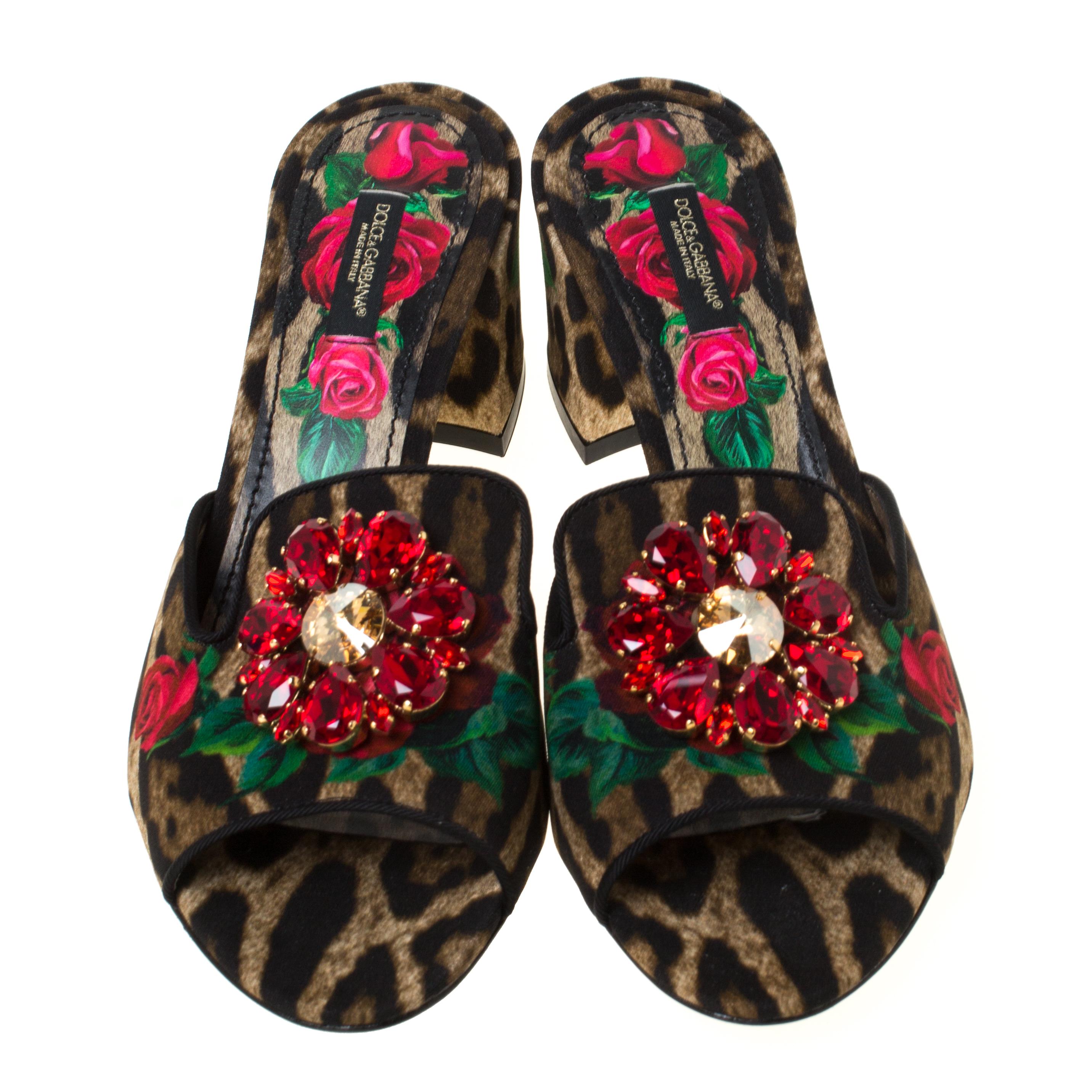 A pair to admire and treasure is this one by Dolce & Gabbana. On the canvas mules, one can see the vibrant and intricate burst of floral and animal prints. They have crystal-embellished uppers, open toes and 7.5 cm heels.

Includes: Original