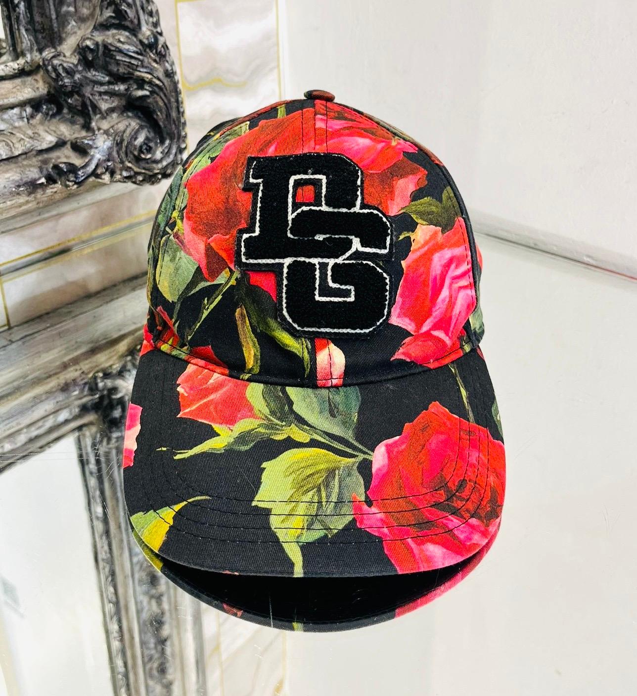 Dolce & Gabbana Floral Print 'DG' Logo Baseball Cap

Black cap designed with rose print in red and green.

Detailed with black 'DG' logo to the front and adjustable, 'Dolce & Gabbana' logo engraved buckle to rear.

Featuring gros-grain interior