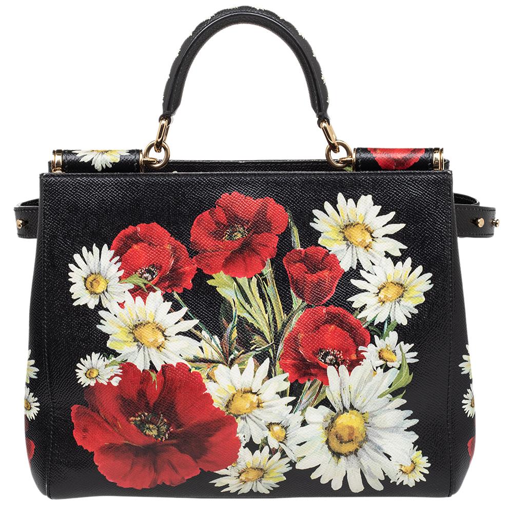 The Miss Sicily tote is one of the most celebrated creations from Dolce & Gabbana. It is a handbag that has not only seen countless adaptations but also gained the love of women for years. This tote here comes in a floral-printed leather design and