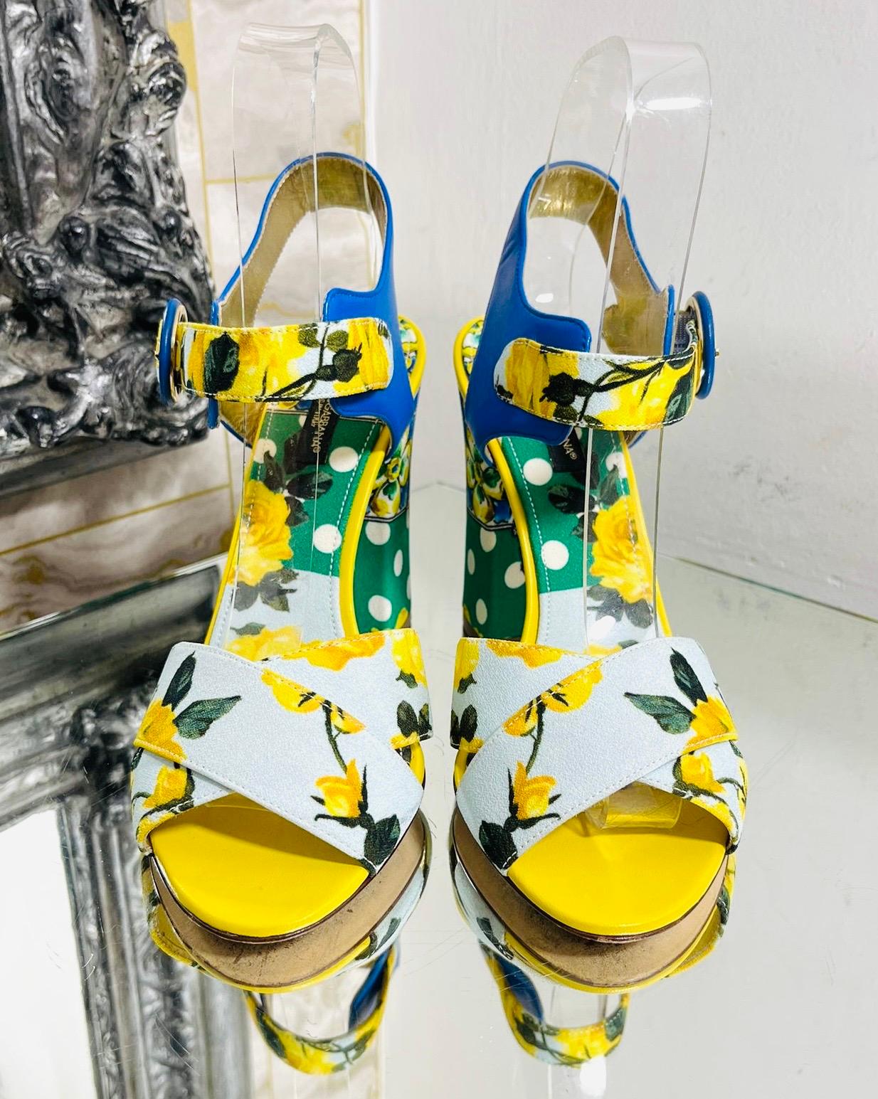 Dolce & Gabbana Floral Print Sandals

Multicoloured heels styled with Mediterranean-themed patterns.

Featuring criss-cross straps and adjustable buckle fastening.

Detailed with polka-dot block heel, open toes and slingback design.

Size –