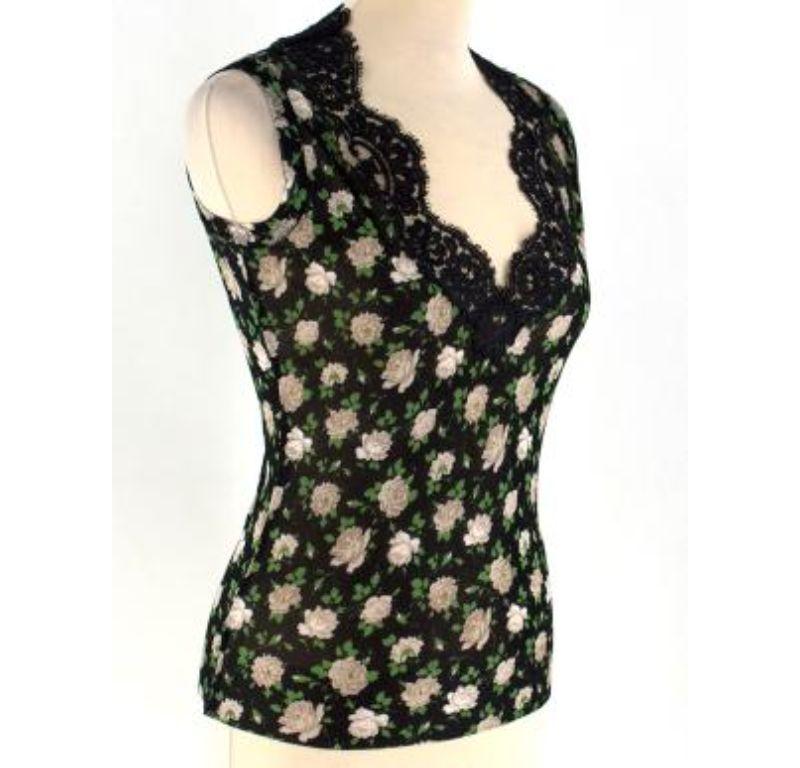 Dolce & Gabbana Floral Print Semi-sheer Knit Top

- Black, green and beige top
- Lightweight
- Floral print
- Semi-sheer knit
- Sleeveless
- V-neck, with lace inserts
- Ribbed cuffs and hem

Please note, these items are pre-owned and may show some