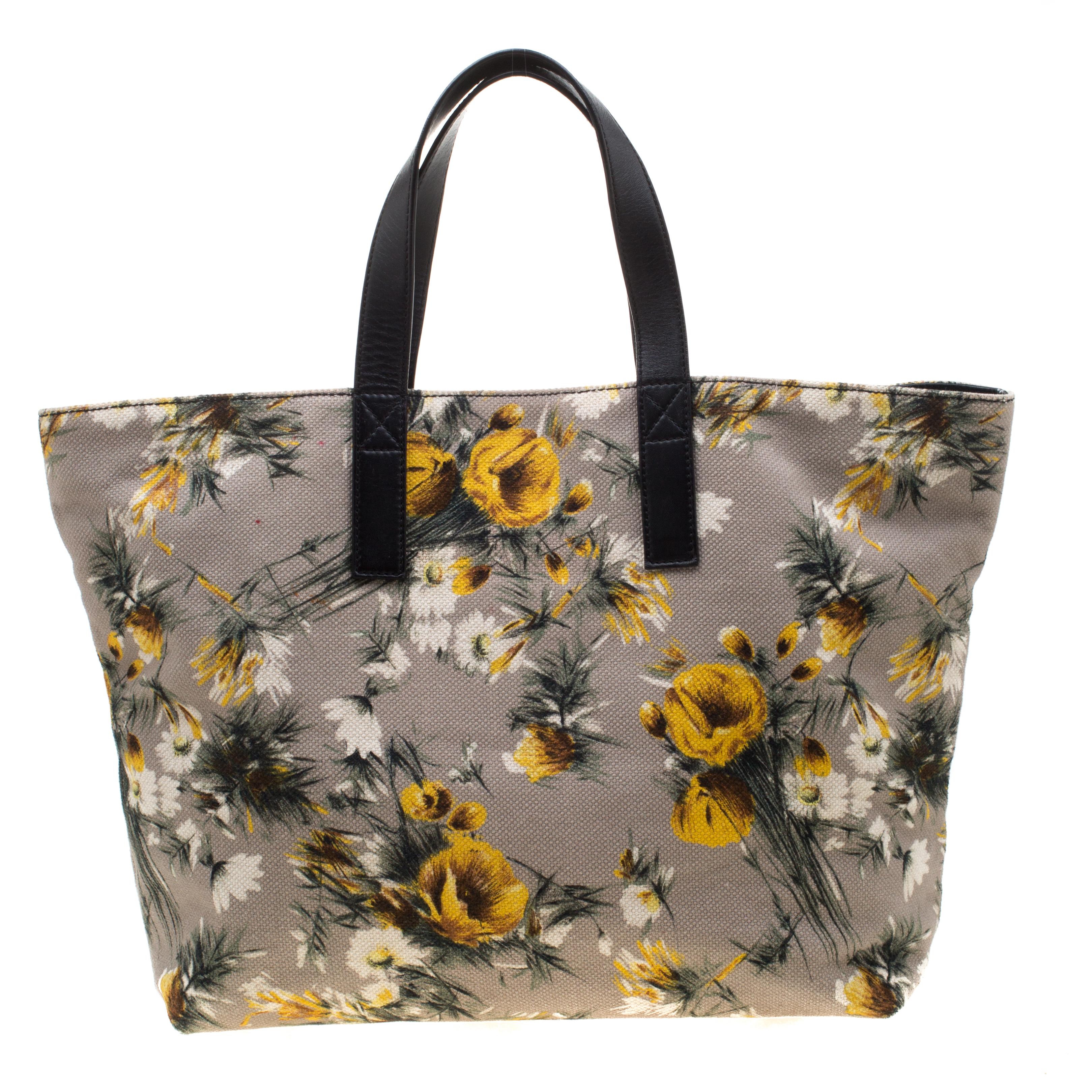 This floral-printed canvas and leather tote is apt for daily use With an expertly lined fabric interior and two leather handles, this can accommodate all your essentials. This piece, from Dolce & Gabbana, is a note on utility and designing.


