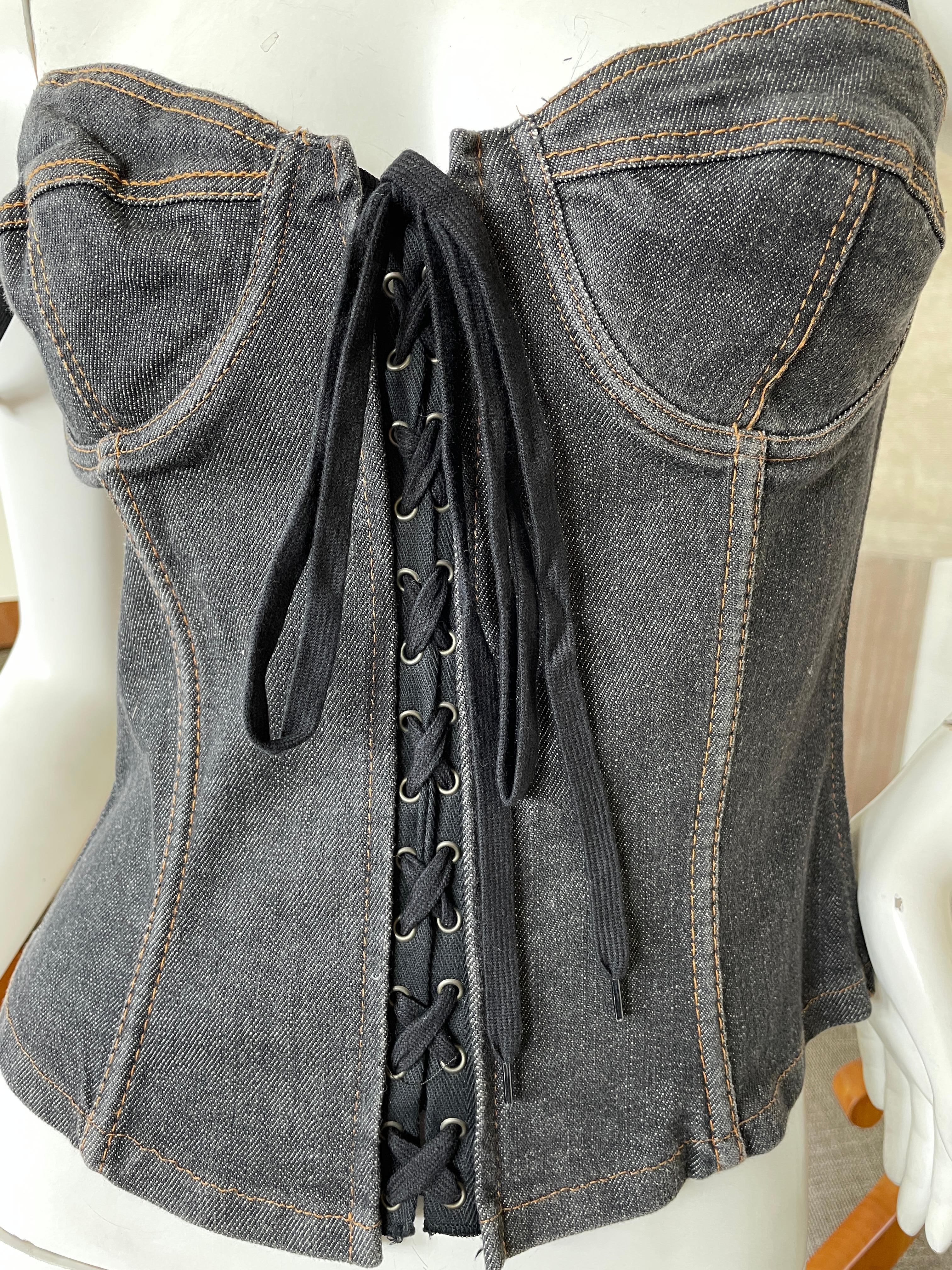 Dolce & Gabbana for D&G Sexy Gray Denim Corset with Lace Up Details.
Zips up the side, the corset lacing up the front and back is ornamental.
Size 40
 Bust 34