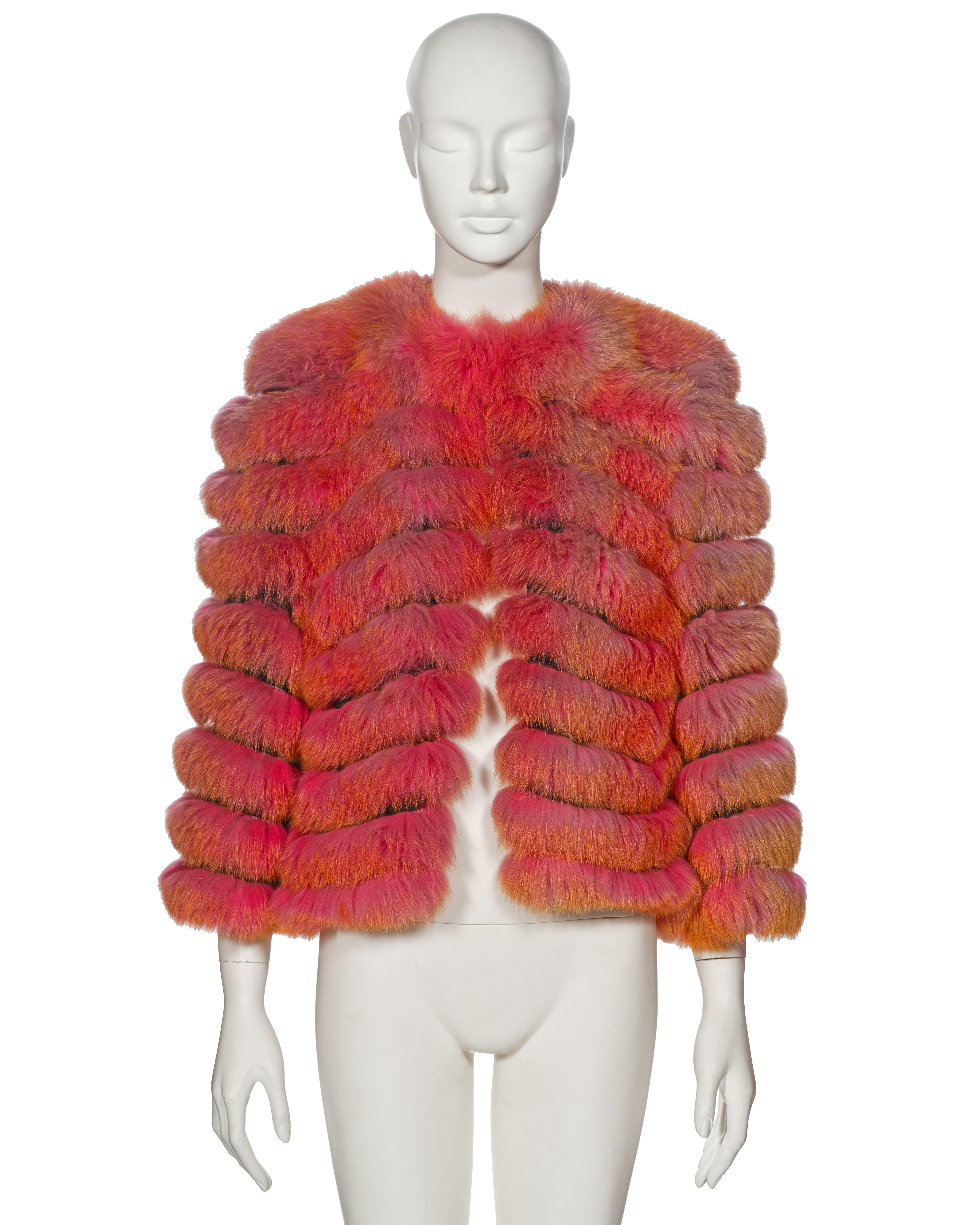 ▪ Archival Dolce & Gabbana Fox Fur Jacket 
▪ Fall-Winter 1999
▪ Sold by One of a Kind Archive  
▪ Meticulously crafted from luxurious fox fur ribbons featuring a captivating pink-to-orange gradient coloration
▪ Secured with a single front