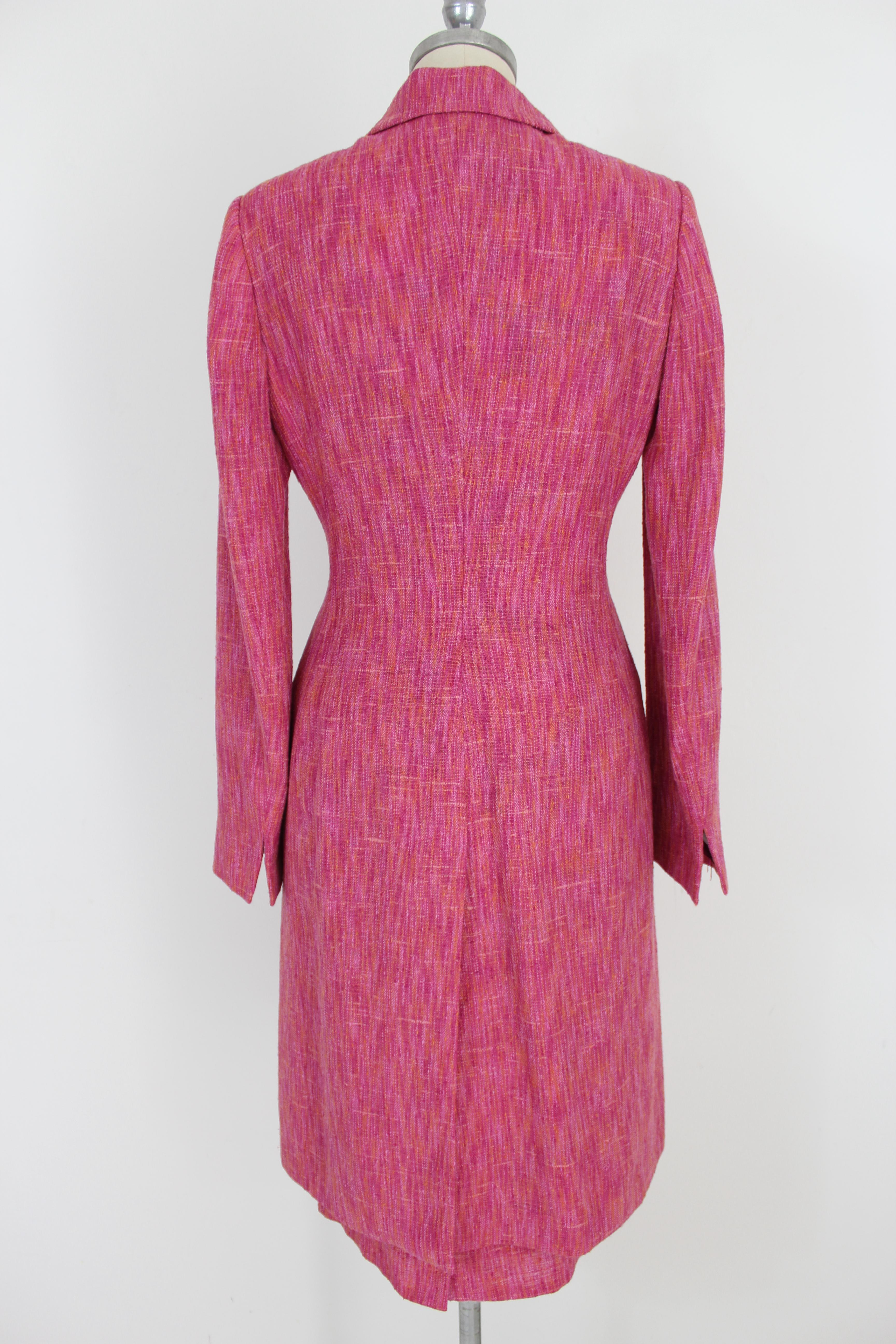 Dolce & Gabbana vintage 90s woman skirt suit. Set consisting of long jacket like coat and skirt, tweed fabric in fuchsia and orange, 48% rayon 30% wool 12% nylon 10% silk. Flower lining interior, jacket with clip closure. Short sheath model skirt.
