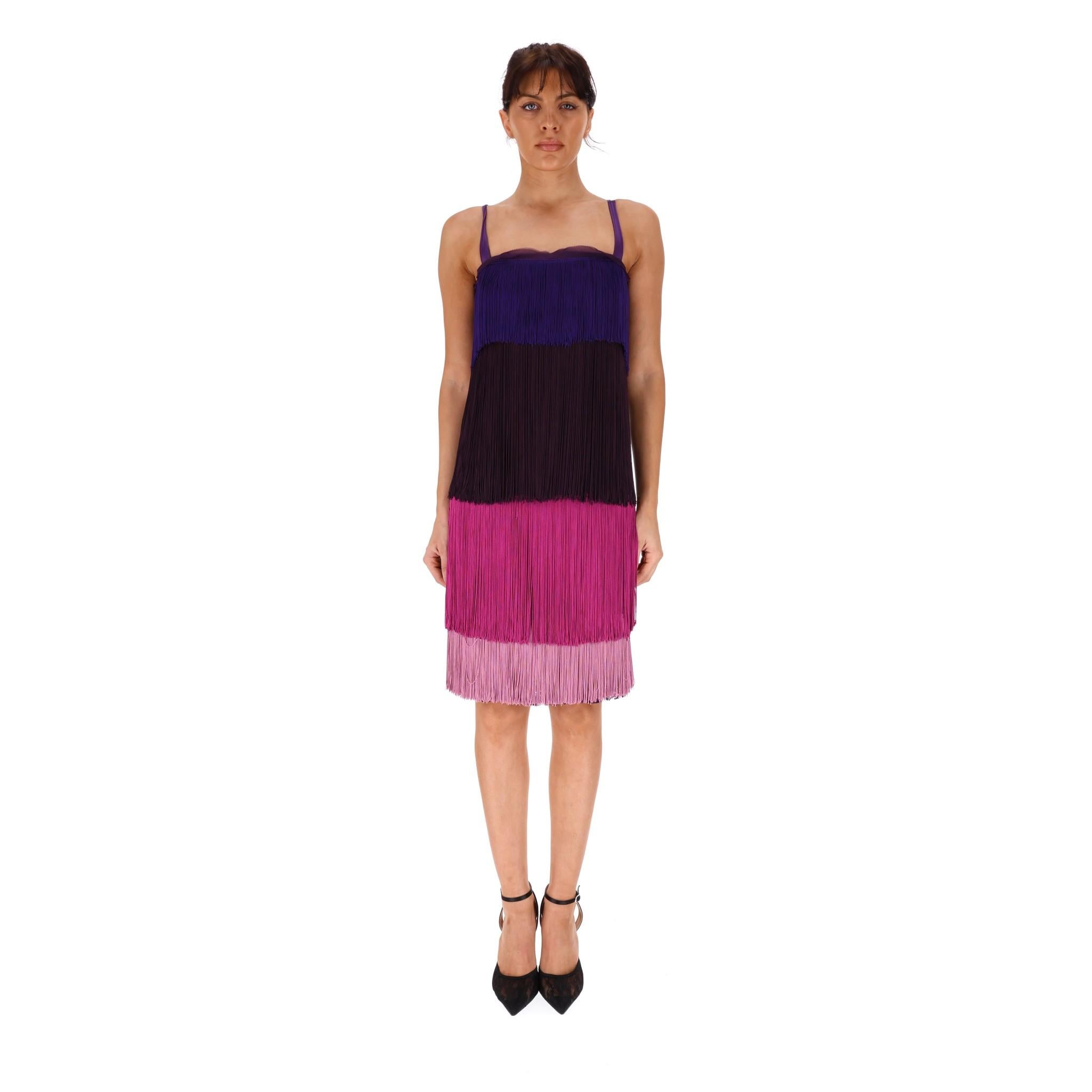 Dolce & Gabbana Fringe & Lace Dress

Bustier styled top with purple shoulder straps and sheer silk to the chest.

Multicolour tiered Fringing in purple, maroon and pink with purple lace under lay detailing.

Size - 40IT

Condition - Very