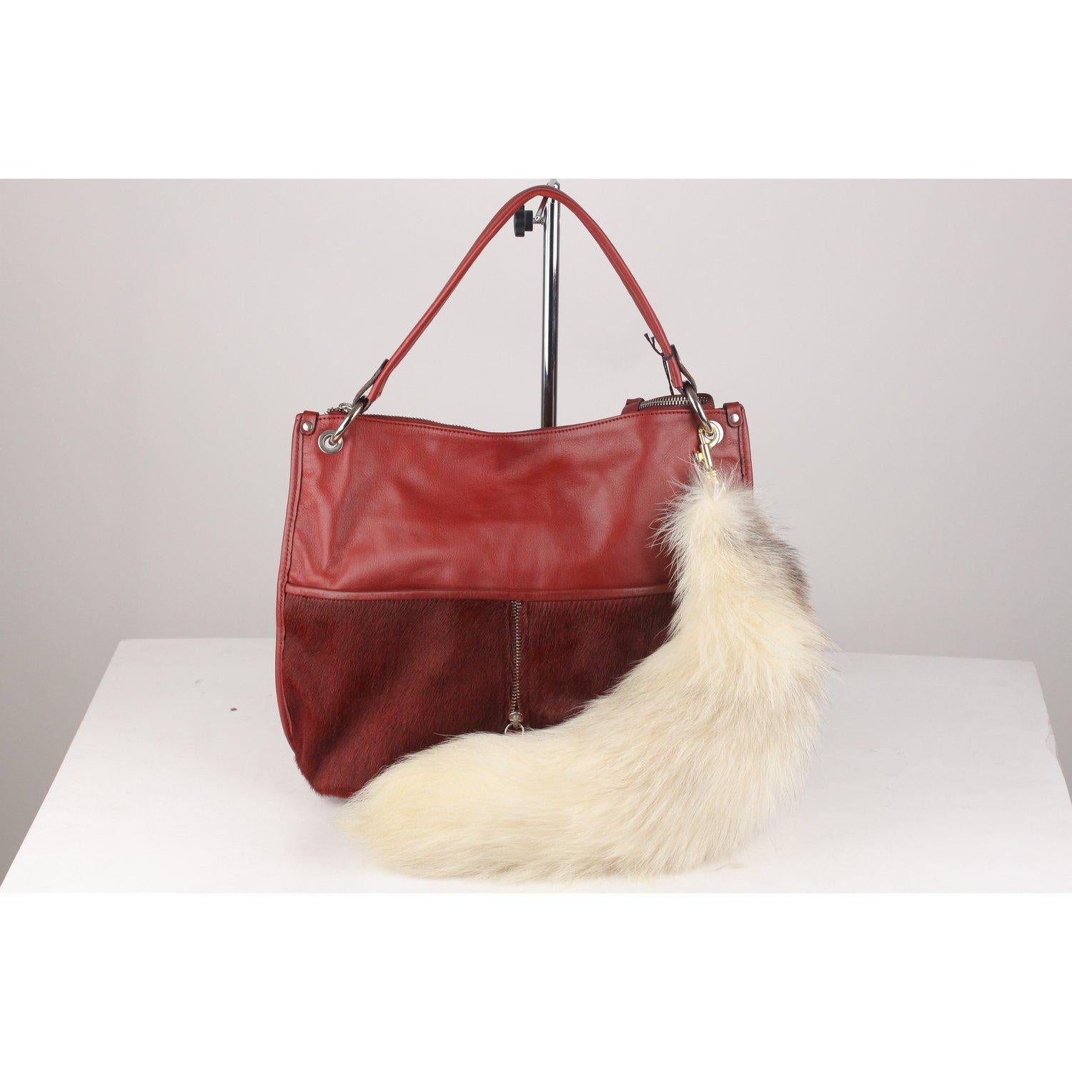 MATERIAL: Fur COLOR: Ivory COUNTRY OF MANUFACTURE: Italy Condition CONDITION DETAILS: A :EXCELLENT CONDITION - Used once or twice. Looks mint. Imperceptible signs of wear - The bag is not for sale, is for demonstration purposes only. - Internal Ref: