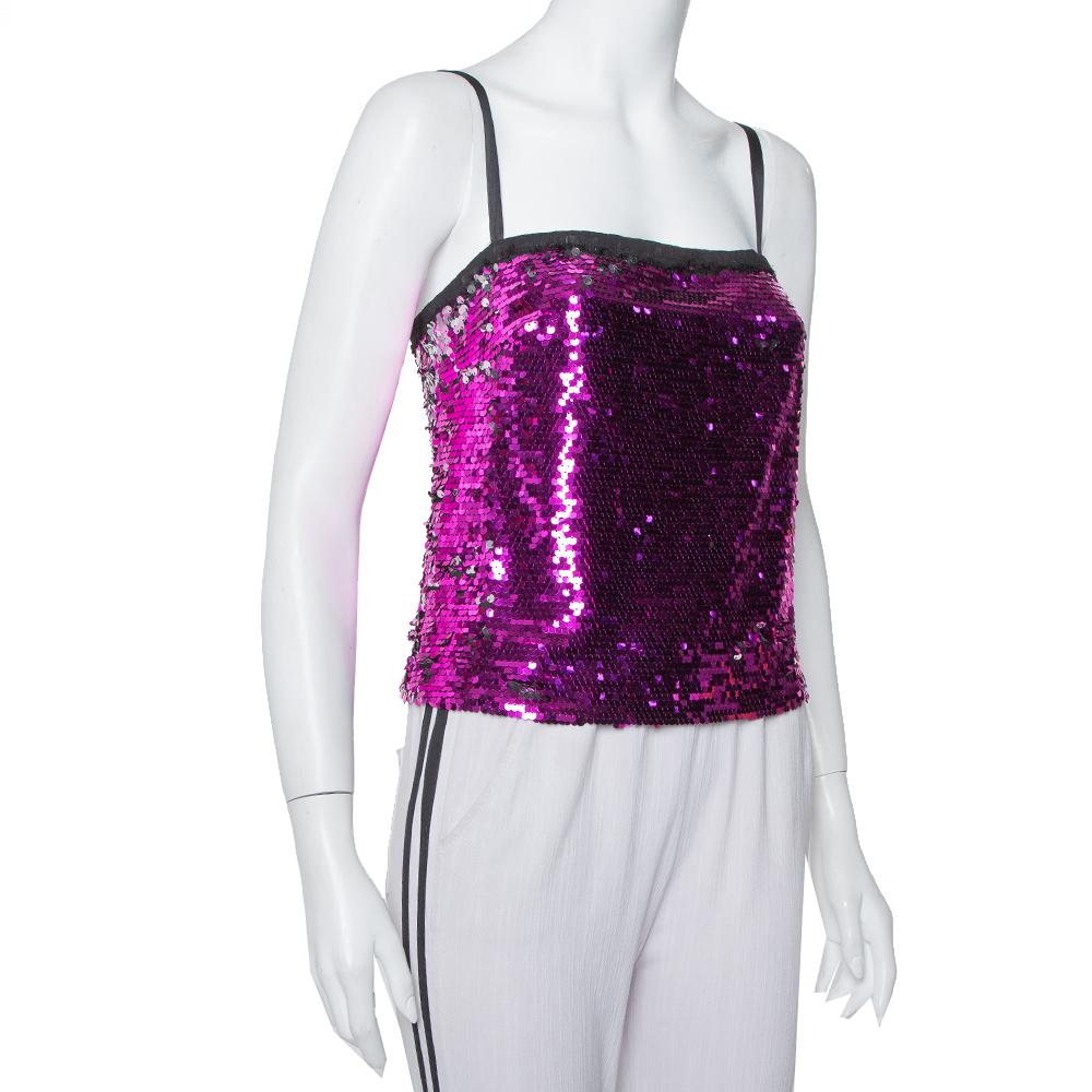 This Dolce & Gabbana camisole top brings a wonderful sight to one's eyes. It flaunts a sleeveless style with sequin paillette detailing all over. The fuchsia pink blouse is lovely and simply high-fashion.

