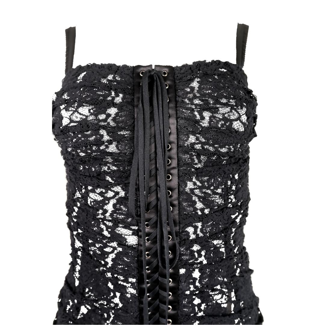 This Dolce & Gabbana lace dress from the Fall/Winter 2018 collection exudes elegance with its figure-flattering ruched design and semi sheer black lace overlay. The material features a subtle stretch in the fabric, allowing for a comfortable and