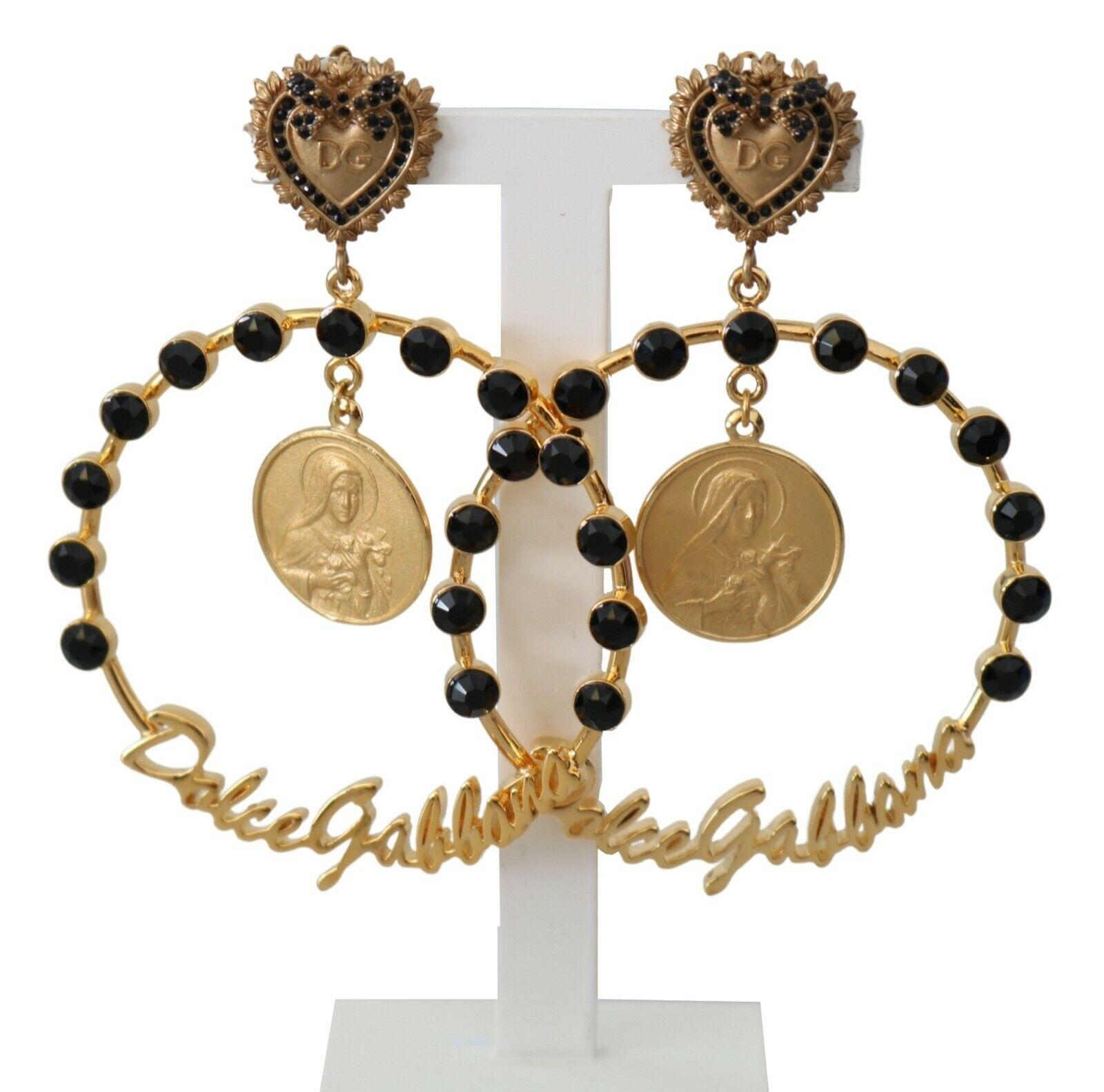  Gorgeous brand new with tags, 100% Authentic Dolce & Gabbana Antiqued gold-tone hanging clip-on earrings. Encrusted with decorative elements in black and a logo.




Model: Clip-on, drop
Motive: Logo
Material: Brass, glass

Color: Gold

Crystal: