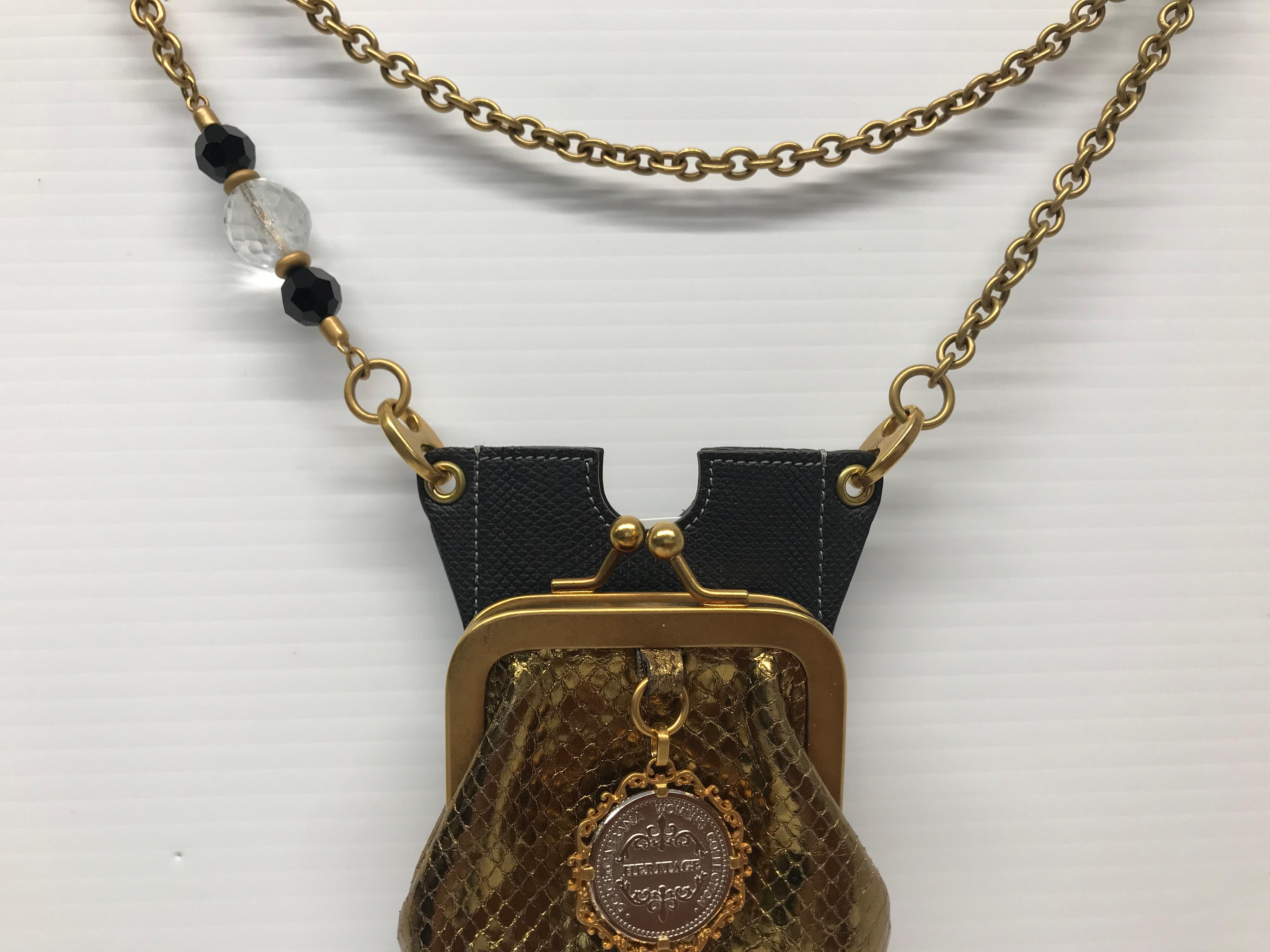 Dolce & Gabbana Gold Black Leather cell phone crossbody bag  with 48 inch chain. With original Dolce & Gabbana purchased card.
