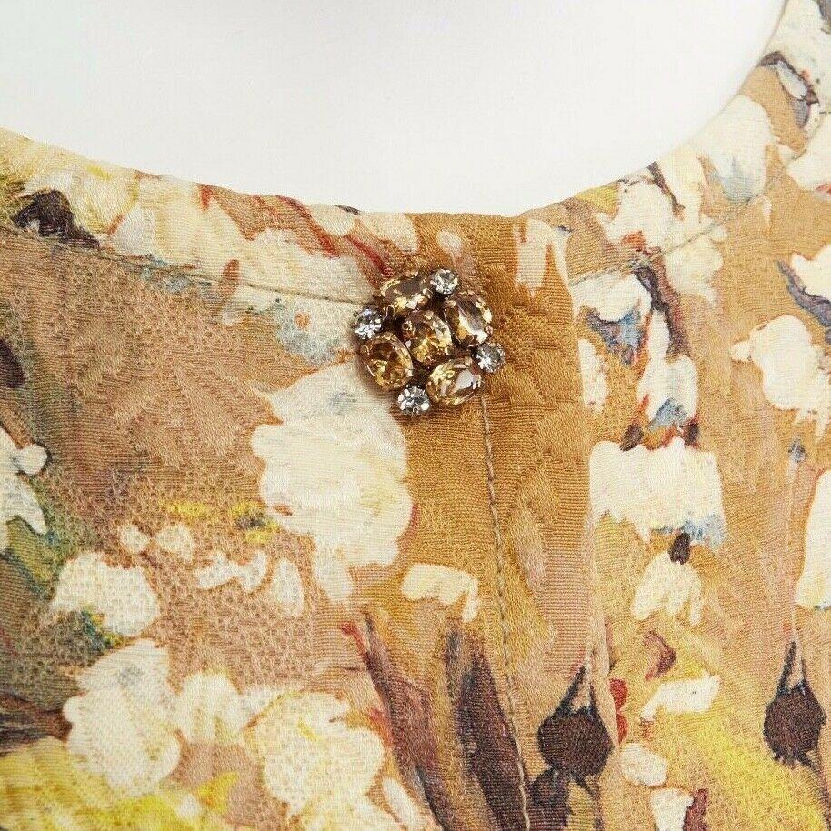 DOLCE GABBANA gold blossom floral brocade cystal button cropped jacket IT40 S
DOLCE & GABBANA
Polyester, elastane. Gold base with floral blossom painting print. Brocade fabric. 
Collarless. Yellow and clear crystal buttons. Concealed button front.