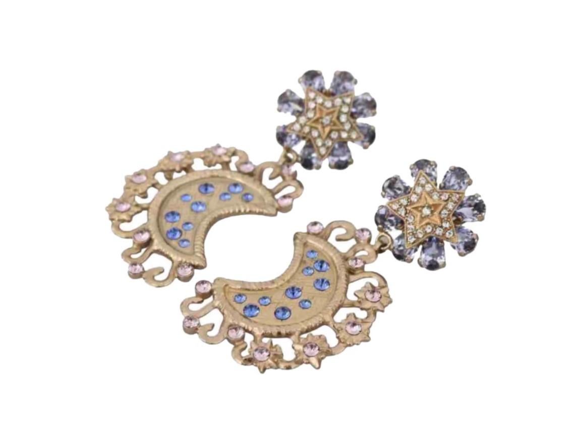 Stunning brand new with tags, 100% genuine Dolce & Gabbana earrings. 
 
 Pattern: Clip on pendant 
 Pattern: Moon, star 
 Material: 30% crystal, 70% brass 
 Color: Gold, blue 
 Crystals: Blue, transparent 
 Logo details 
 Made in Italy 
 
 Length: 7