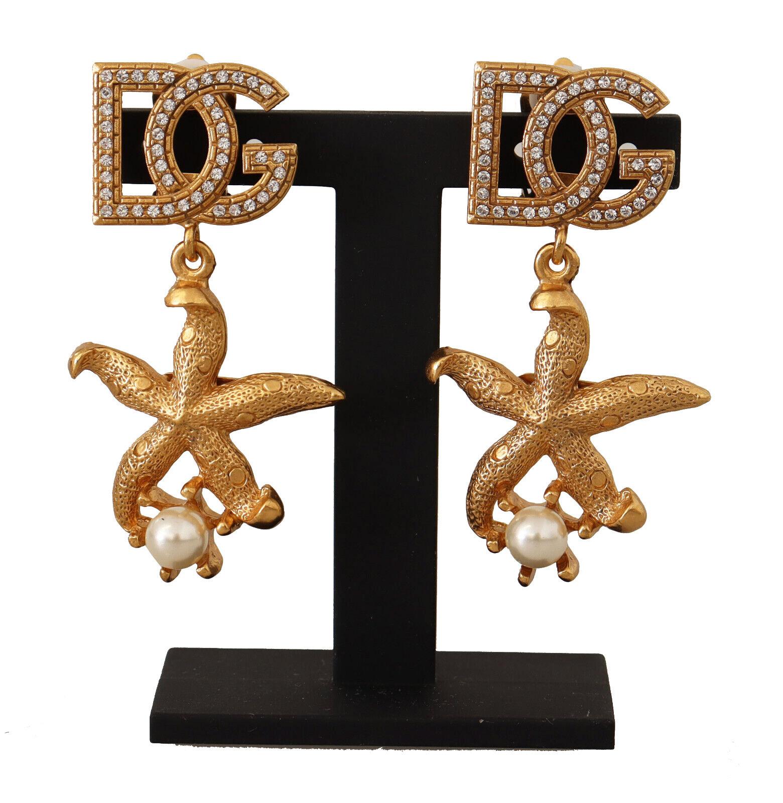 Dolce & Gabbana
Gorgeous brand new with tags, 100% Authentic Dolce & Gabbana Earrings.


Model: Clip-on Dangling
Motive: Starfish
Material: 80% Brass, 20% Glass

Color: Gold

Logo details
Made in Italy

Length: 5cm


Dolce & Gabbana Box, Original
