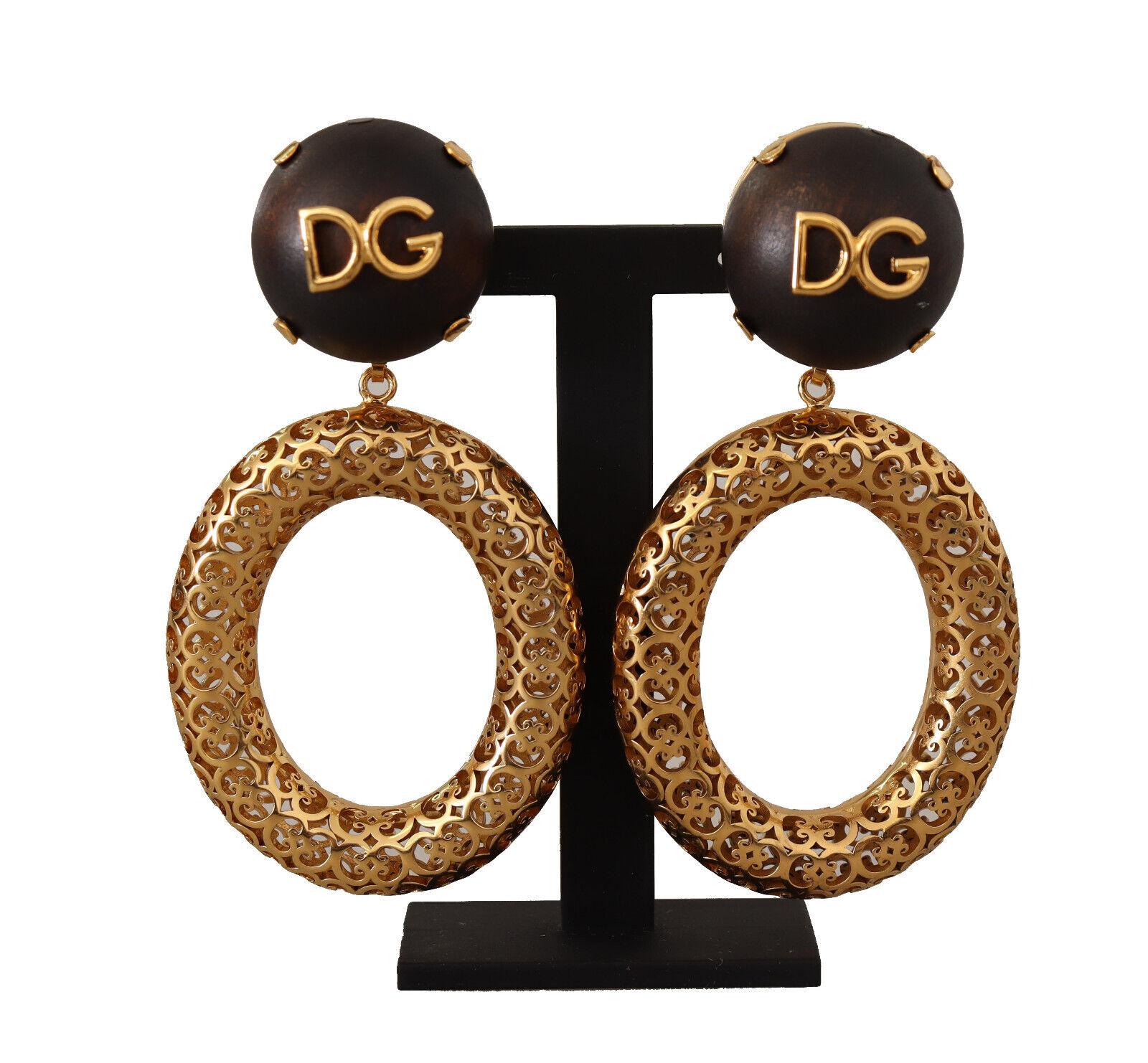 DOLCE & GABBANA

Gorgeous brand new with tags, 100% Authentic Dolce & Gabbana Earrings.

Model: Clip-on dangling hoop
Motive: Sicily
Material: 80% Brass, 20% Wood

Color: Gold and brown

Logo details
Made in Italy

Length: 8cm

Dolce & Gabbana Box,