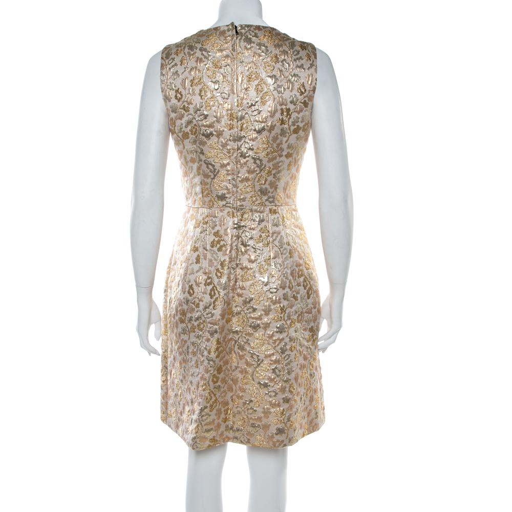 A glamorous party piece, this crystal embellished jacquard dress from Dolce & Gabbana has been elegantly tailored from a blend of fabrics. It boasts a feminine design while sparkling crystal embellishment adorns the neckline for a glamorous finish.