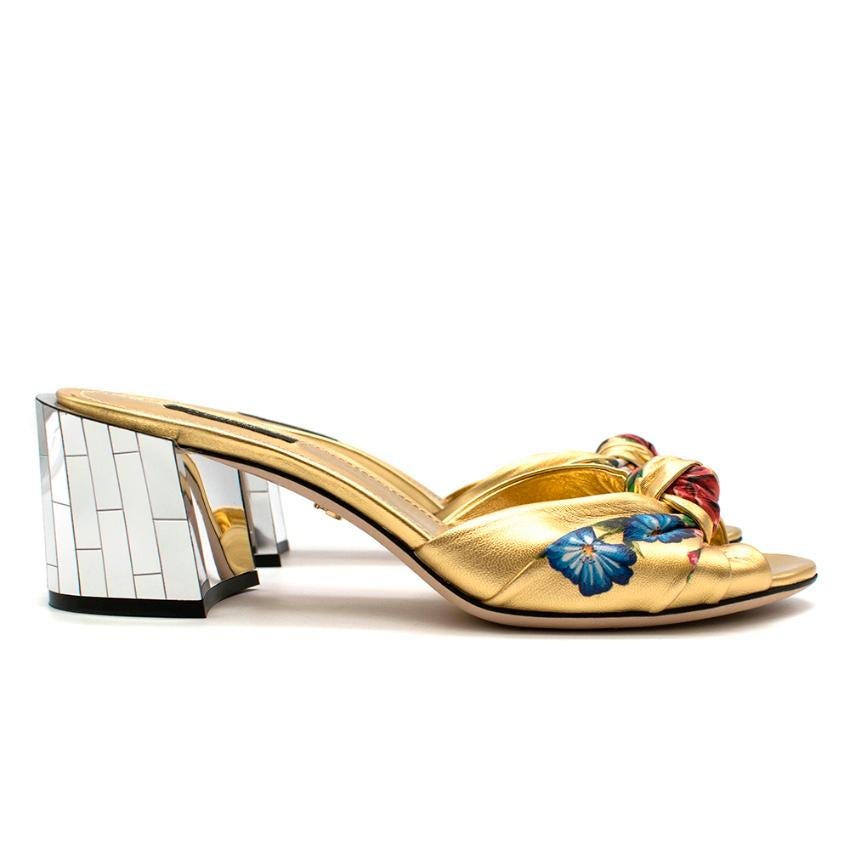 Dolce & Gabbana Gold Floral Knotted Sandals with Mirrored Block Heel

slip on - block mirrored heel - knotted toe - floral print - gold DG on the sole

Please note, these items are pre-owned and may show signs of being stored even when unworn and