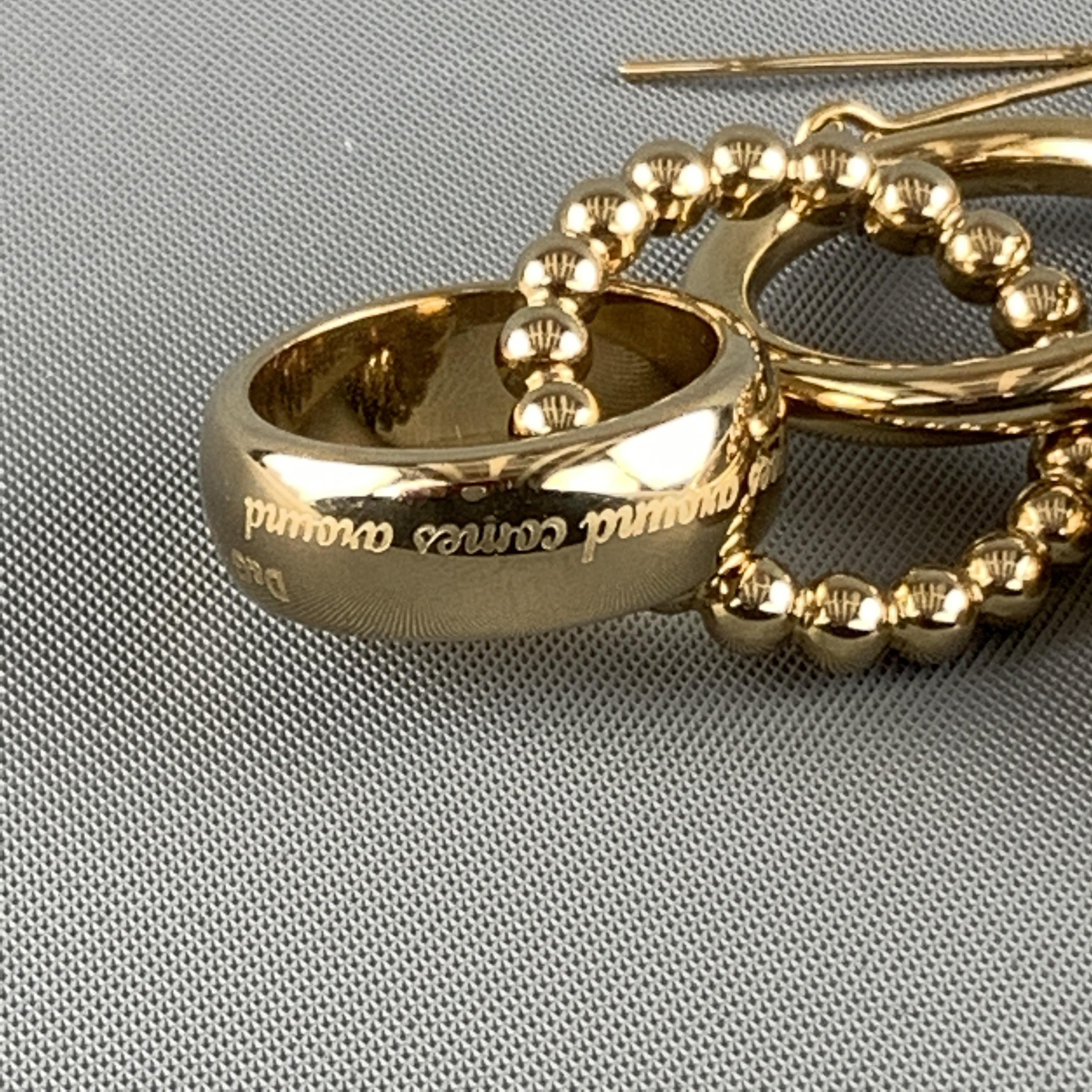 D&G DOLCE & GABBANA earrings come in gold tone meatal and feature three hoop rings with 