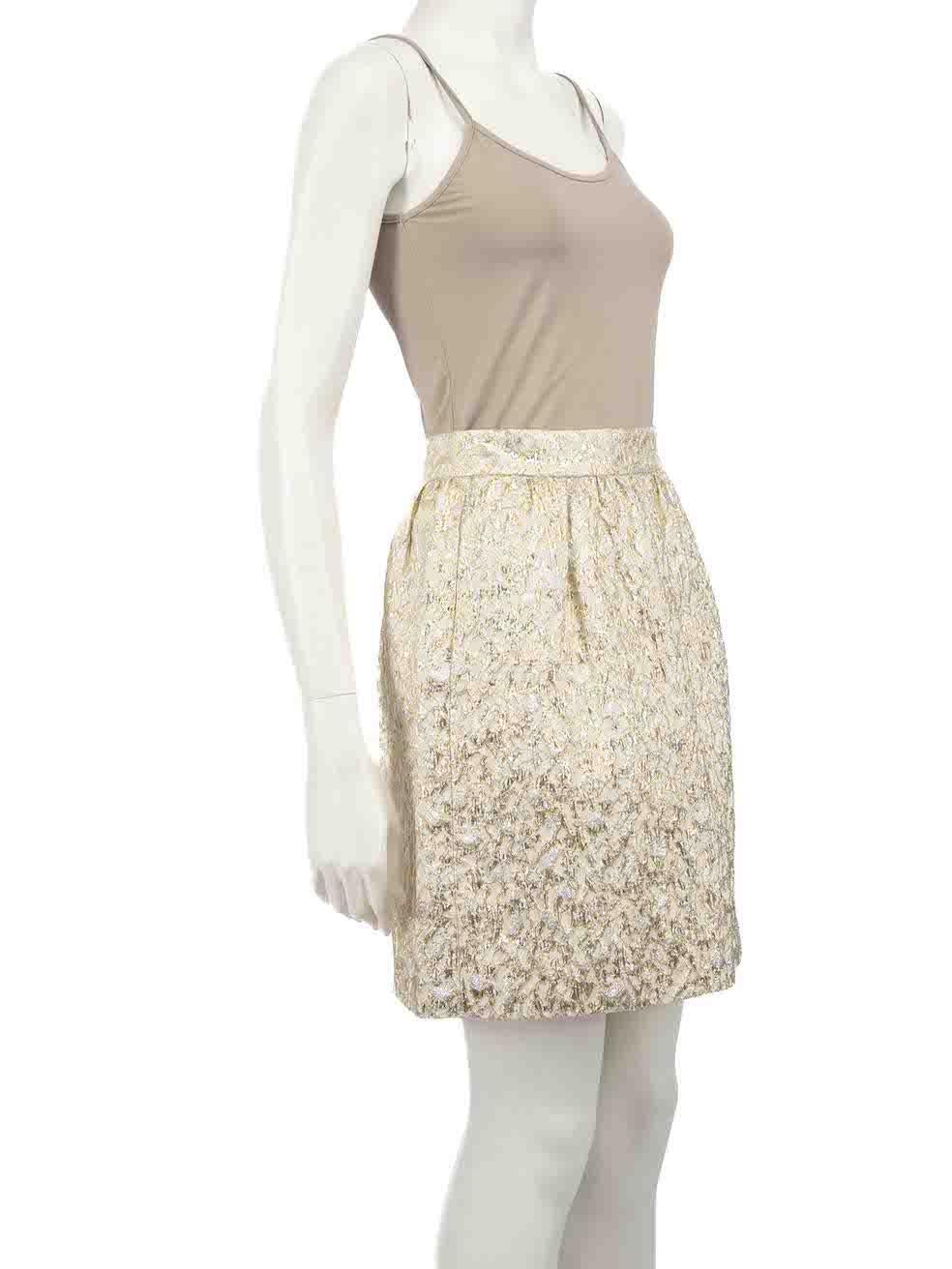 CONDITION is Very good. Hardly any visible wear to skirt is evident on this used Dolce & Gabbana designer resale item.
 
 
 
 Details
 
 
 Gold metallic
 
 Synthetic
 
 Flared skirt
 
 Abstract pattern
 
 Mini
 
 Silver metallic accent
 
 Back zip