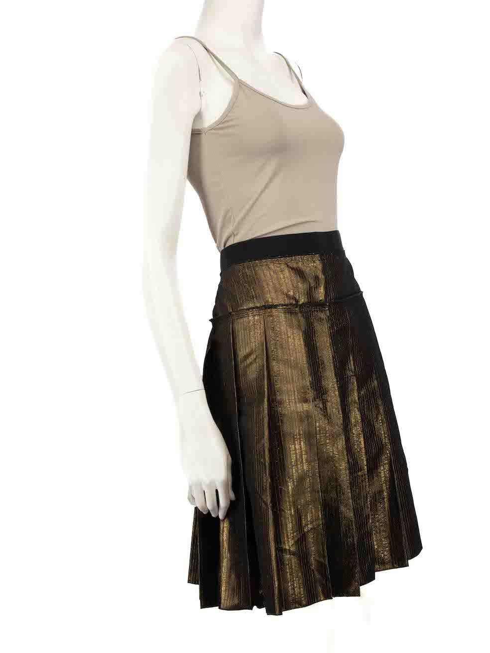 CONDITION is Very good. Hardly any visible wear to skirt is evident on this used D&G designer resale item.
 
 
 
 Details
 
 
 Gold
 
 Synthetic
 
 Skirt
 
 Pleated
 
 Mini
 
 Back zip fastening
 
 
 
 
 
 Made in Italy
 
 
 
 Composition
 
 68%