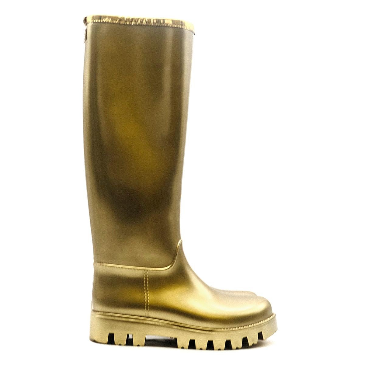 Dolce & Gabbana Gold Rubber Wellington Boots

- Knee High 
- PVC
- Gold Color 
- Rubber sole
- Logo details at top back 

Please note, these items are pre-owned and may show some signs of storage, even when unworn and unused. This is reflected