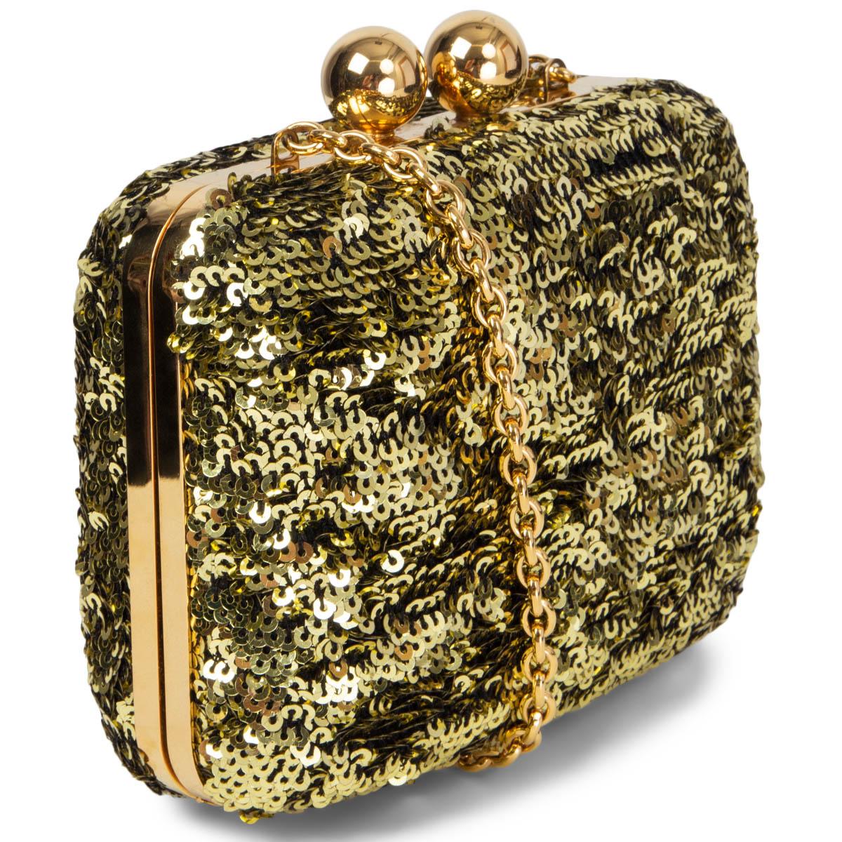 100% authentic Dolce & Gabbana Minaudière with Chain clutch in gold-tone sequins and hardware. Opens with a clasp closure and is lined in black velvet. Has been carried and is in excellent condition. Can be carried as a clutch or shoulder bag. Comes