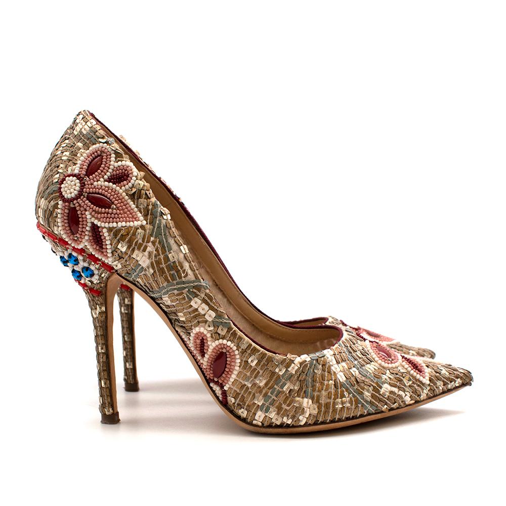 Dolce & Gabbana Gold Sequin Embellished Leather Pumps

-Gorgeous sequin, bead, and crystal embellishments
-Pointed toe
-Stiletto heel
-Floral embellishment detailing to the toe
-Blue and red crystal detailing to the heel
-Timeless statement