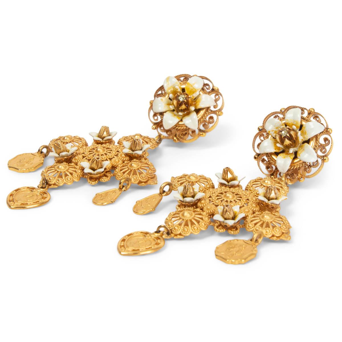 100% authentic Dolce & Gabbana Sicily Cross Madonna & Flower drop clip-on earrings with gold-tone brass filigree and white resin flowers. Have been worn and are in excellent condition. 

Measurements
Width	4.8cm (1.9in)
Length	8.8cm