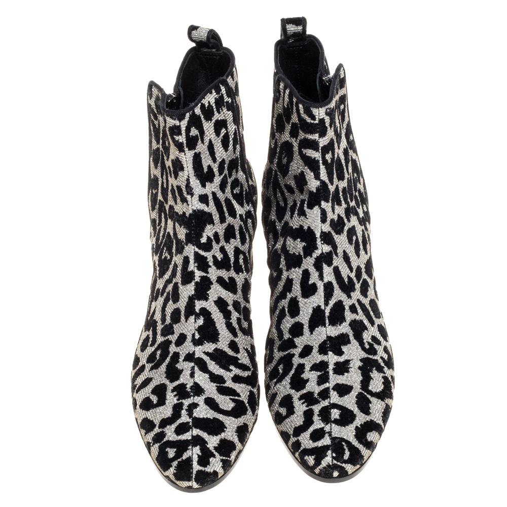 Known for its finesse and impeccable artistry, Dolce & Gabbana again surprises us with these stylish boots. Crafted from leopard-printed lurex, the boots feature almond toes and are lined with leather. Block heels complete these beauties.

