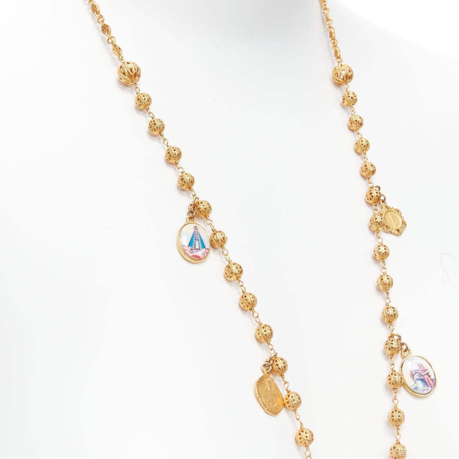 Women's DOLCE GABBANA gold tone Jesus cross Saints coin charm long rosary necklace For Sale