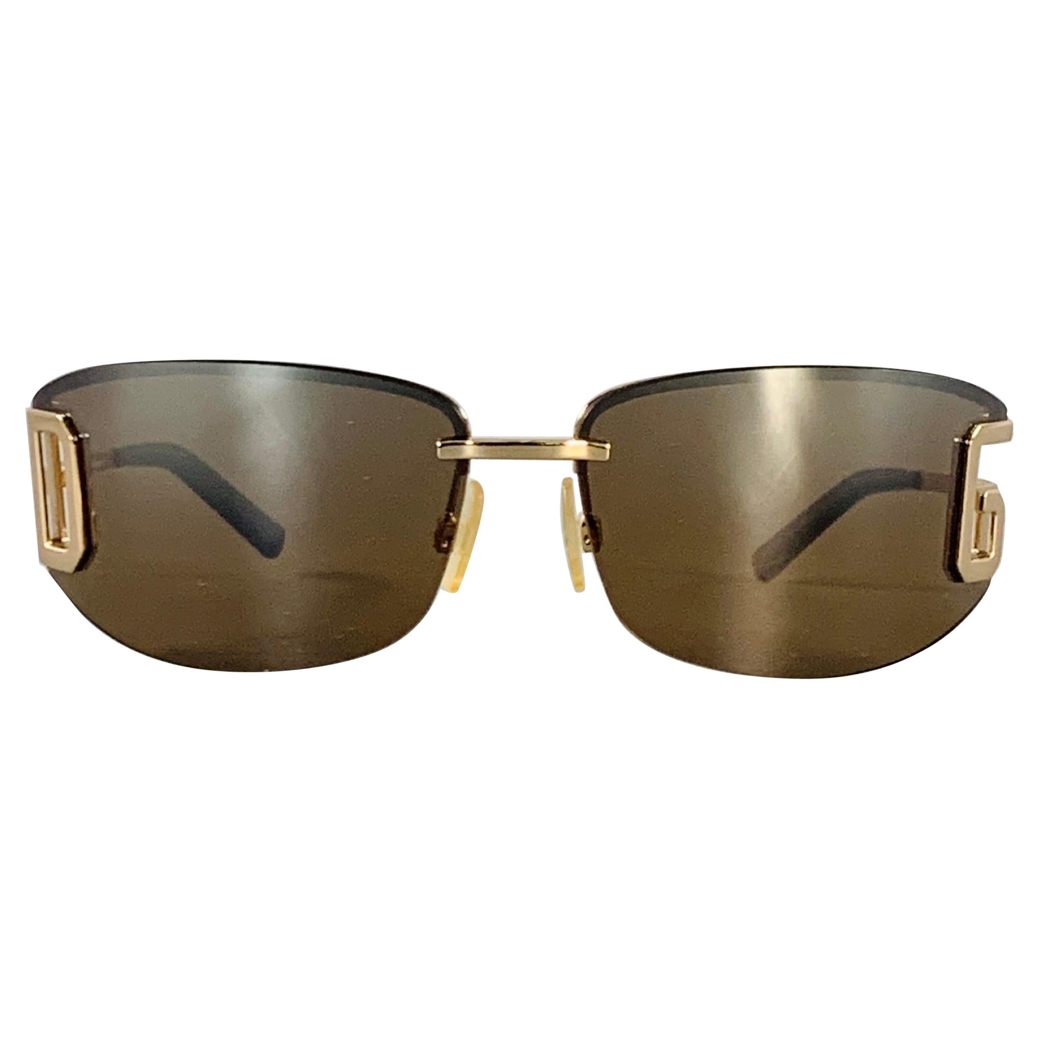Gafas de sol envolventes con monograma metálico en carey dorado DOLCE 
GABBANA en venta