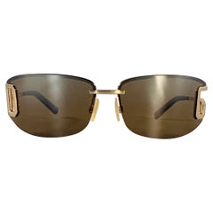 Gafas de sol envolventes con monograma metálico en carey dorado DOLCE
GABBANA Gafas de sol envolventes con monograma metálico en carey dorado DOLCE
GABBANA