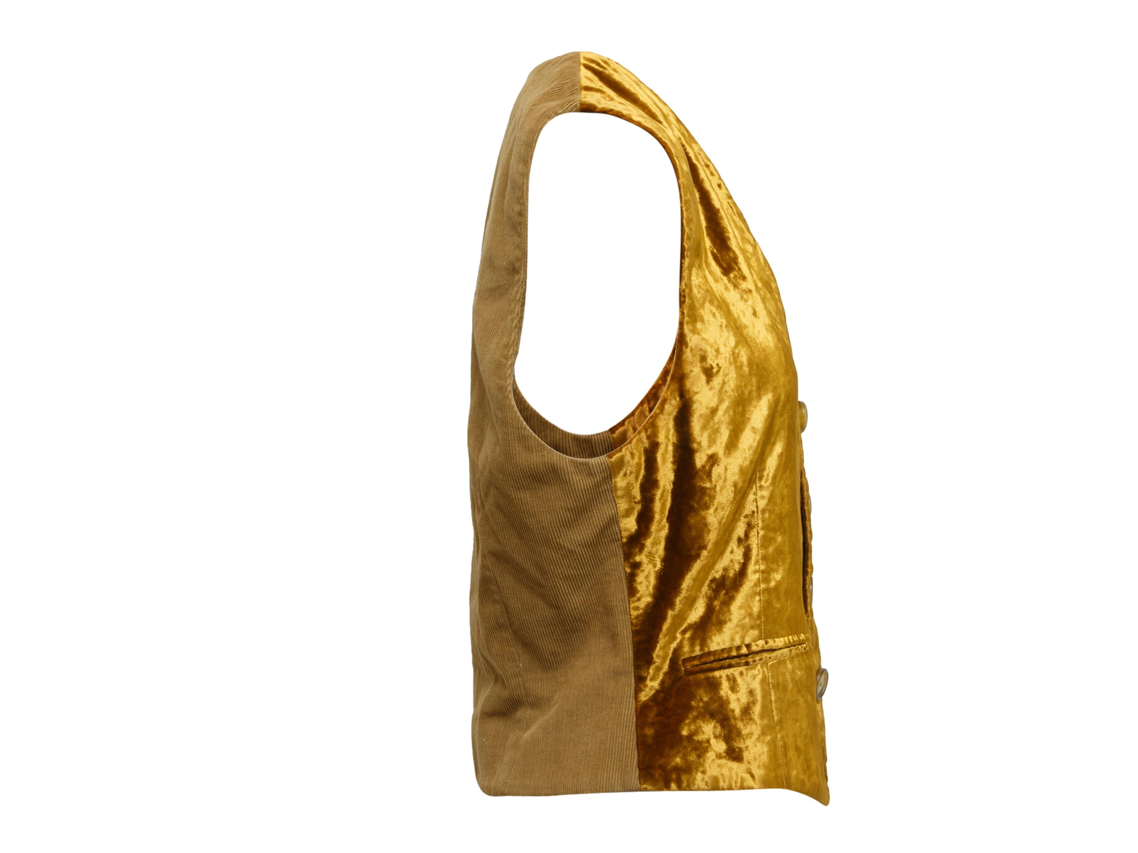 Product details: Vintage gold velvet vest by Dolce & Gabbana. V-neckline. Three welt pockets. Contrast fabric panel at back. Button closures at center front. Designer size IT38. 38