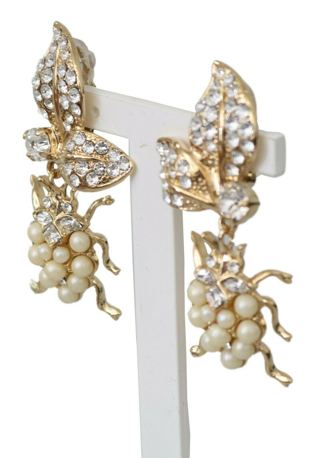 100% Authentic Dolce & Gabbana FAUX PEARLS & LIGHT CRYSTALS BUGS EARRINGS 
 
 
 • CLIP ON DANGLING 
 
 • BUGS MOTIVE 
 
 • MATERIAL: 60% OTTONE 10% PLASTIC 30% VETRO 
 
 • COLOR: WHITE, SILVER 
 
 • CRYSTALS: CLEAR 

 • LENGTH: 5.5cm 
 
 • DELIVERED