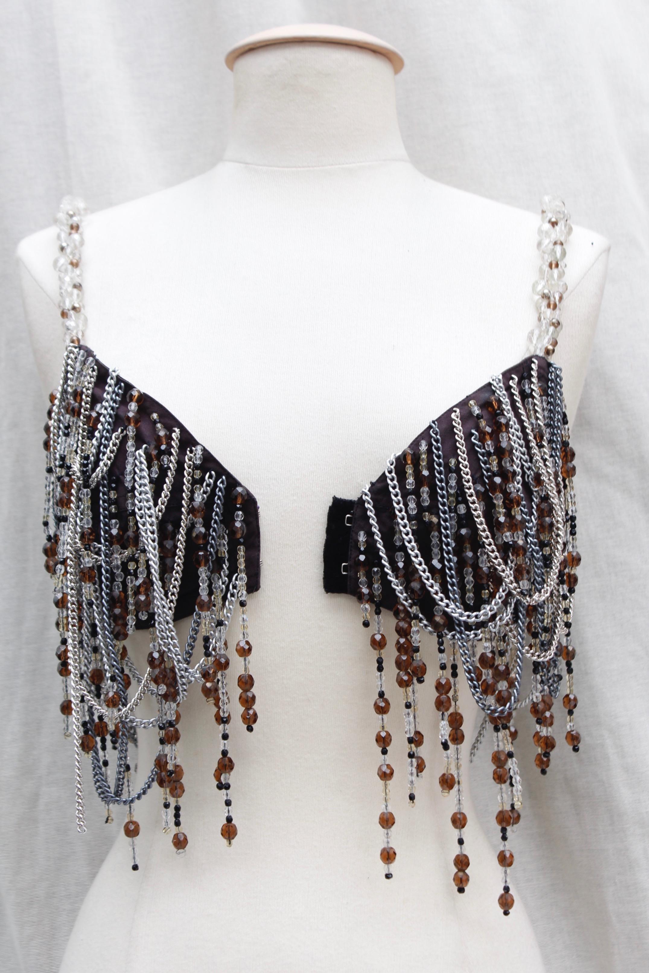 DOLCE & GABBANA DEFILE (Attributed to – Made in Italy) Gorgeous jewel bra composed of brown and black canvas entirely covered with silver plated small chains, further decorated with bead fringes in brown, taupe and black colors. The shoulder straps