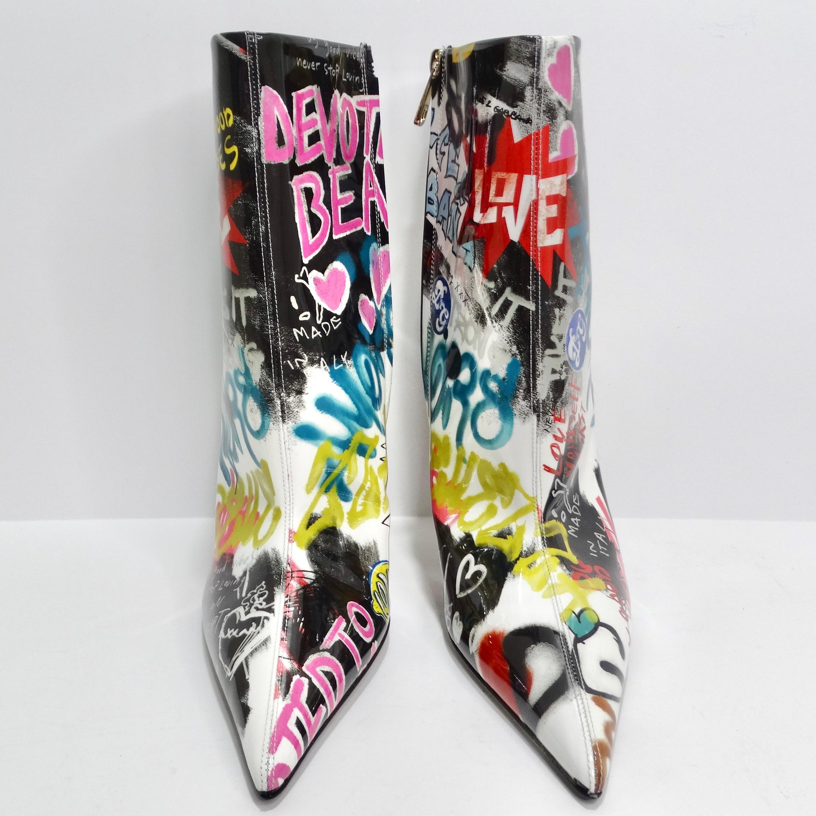 Introducing the Dolce & Gabbana Graffiti Print Ankle Boots – a bold and vibrant expression of fashion that brings together high style and playful artistry. These multicolor patent leather ankle boots are not just shoes; they're a canvas of whimsical