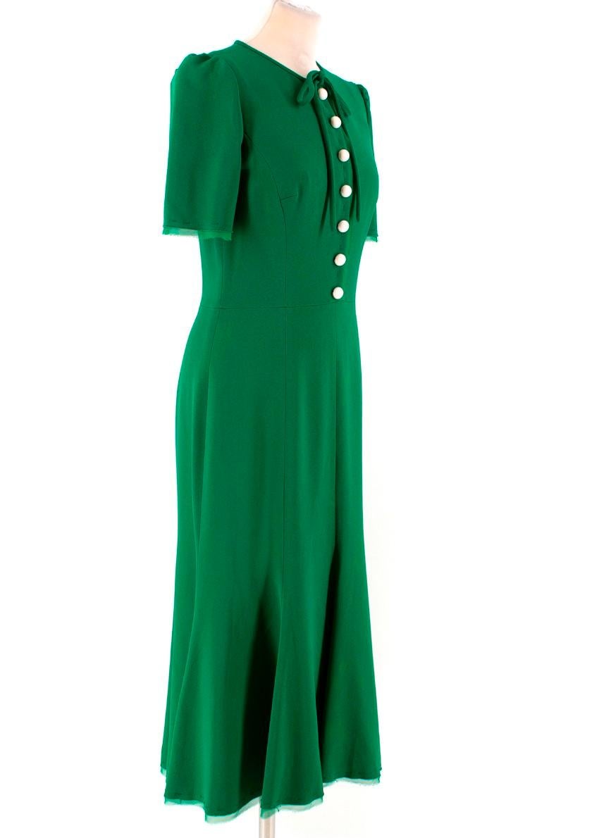 Dolce & Gabbana green button-down cady midi dress

- Emerald-green, stretch cady 
- Round neck, short puff sleeves 
- Matching self- fastening neck tie
- Emerald-green raw-edge chiffon trimmed cuffs, placket and hem, green top stitching
-
