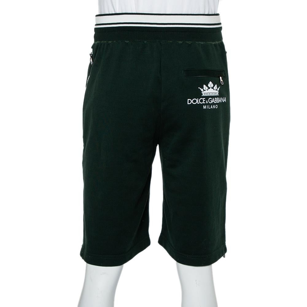 Lounge around in comfort and style in these Bermuda shorts from the house of Dolce & Gabbana! These green shorts are made from a blend of fine fabrics and feature a simple silhouette. They flaunt an elasticized waistline with a drawstring and three