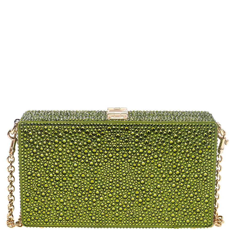 Dolce & Gabbana formulates for the fashion-forward and pioneers of style. This Dolce box bag is no different. Made in Italy, it is made from satin and comes in a lovely shade of green. The bag flaunts crystal embellishments. It is styled with an
