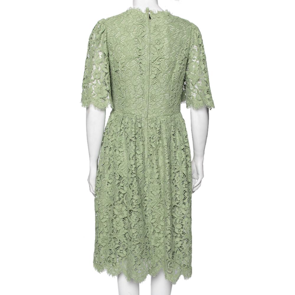 Intricately stitched using floral lace fabric, this dress from the House of Dolce & Gabbana will add a finesse element to your wardrobe. It flaunts a green hue, a flared silhouette, and a zipper fastening at the back. Bring charm and beauty to your